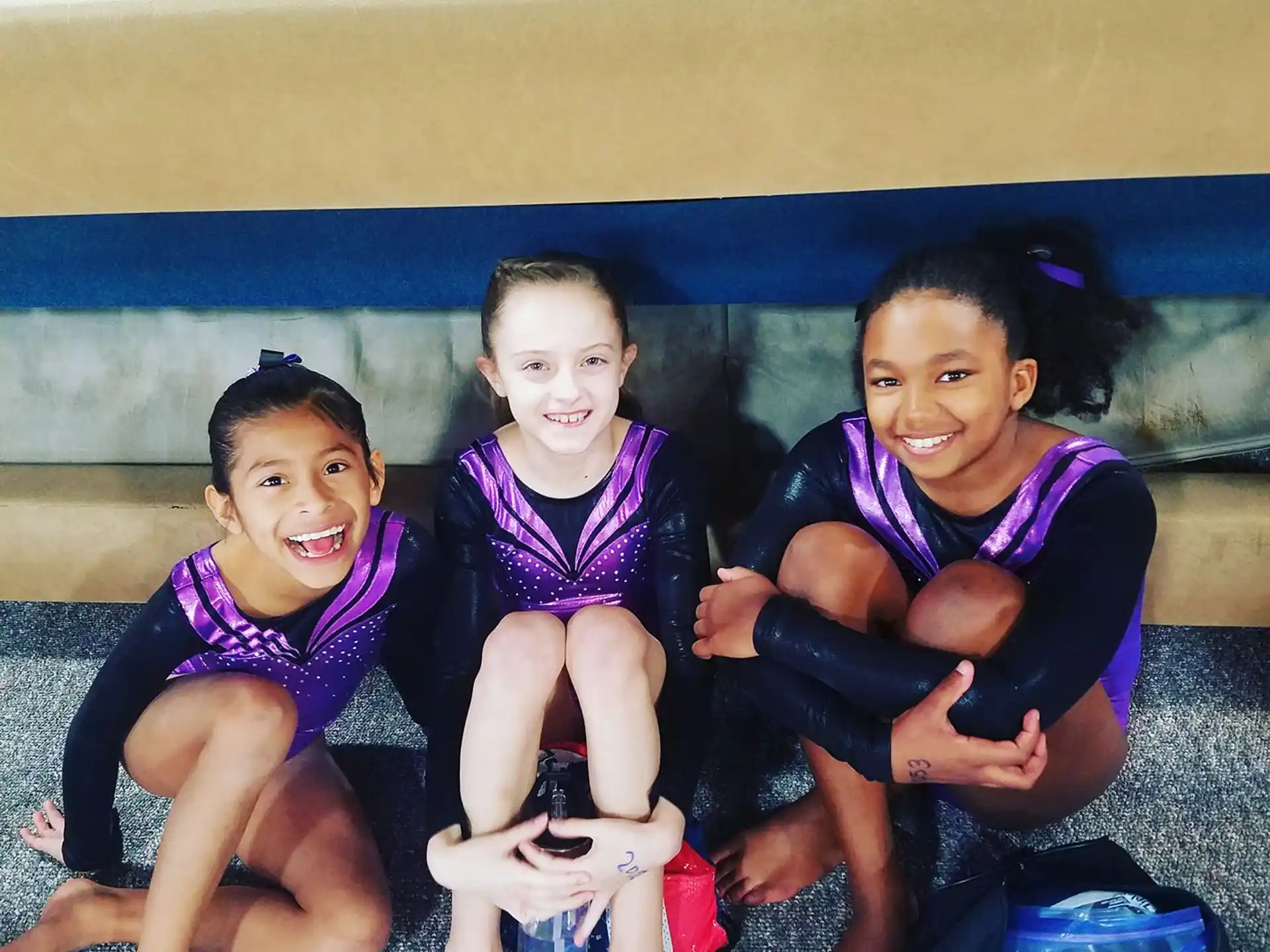 a group of girls in purple uniforms