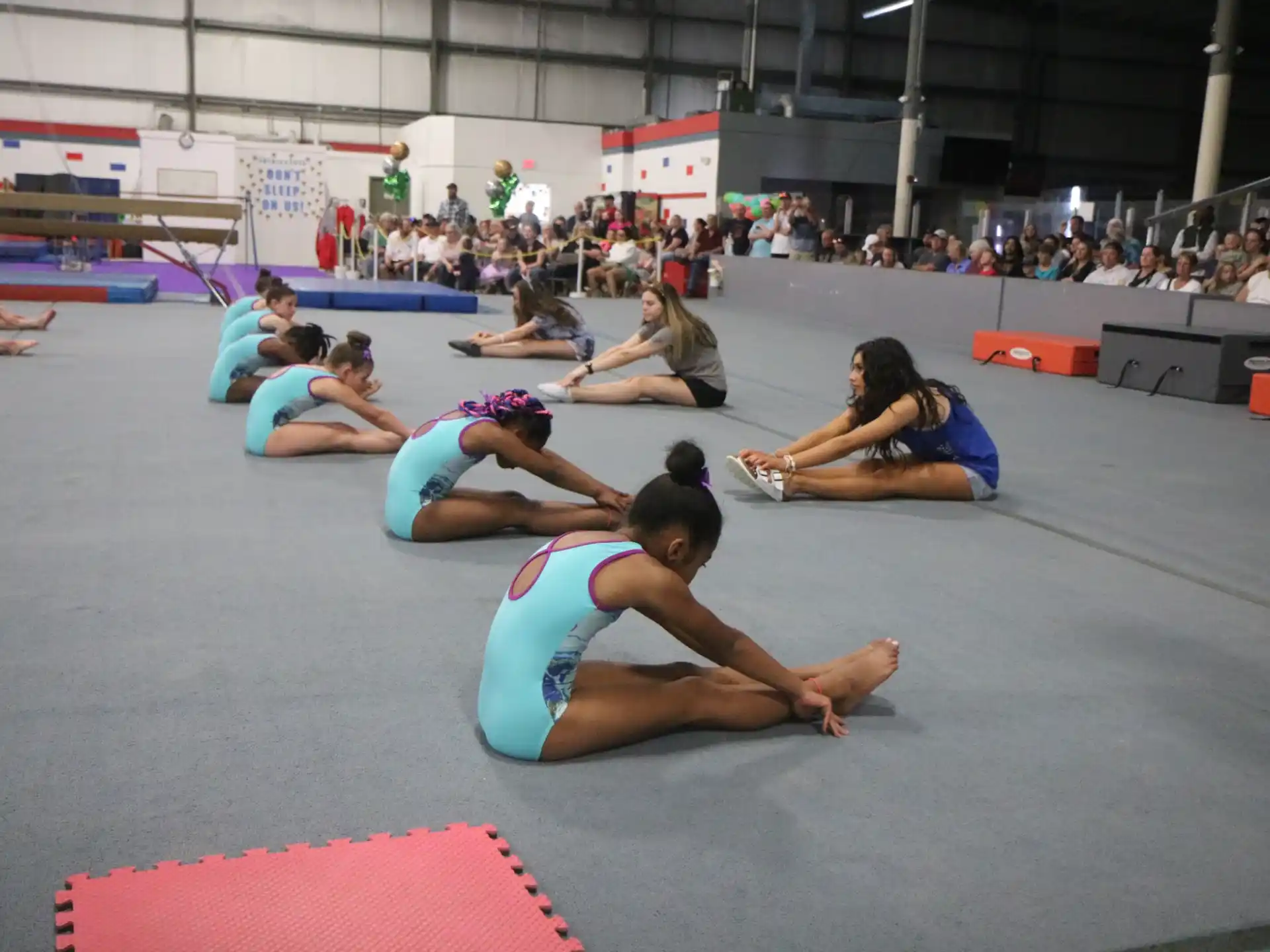 a group of people in a gym