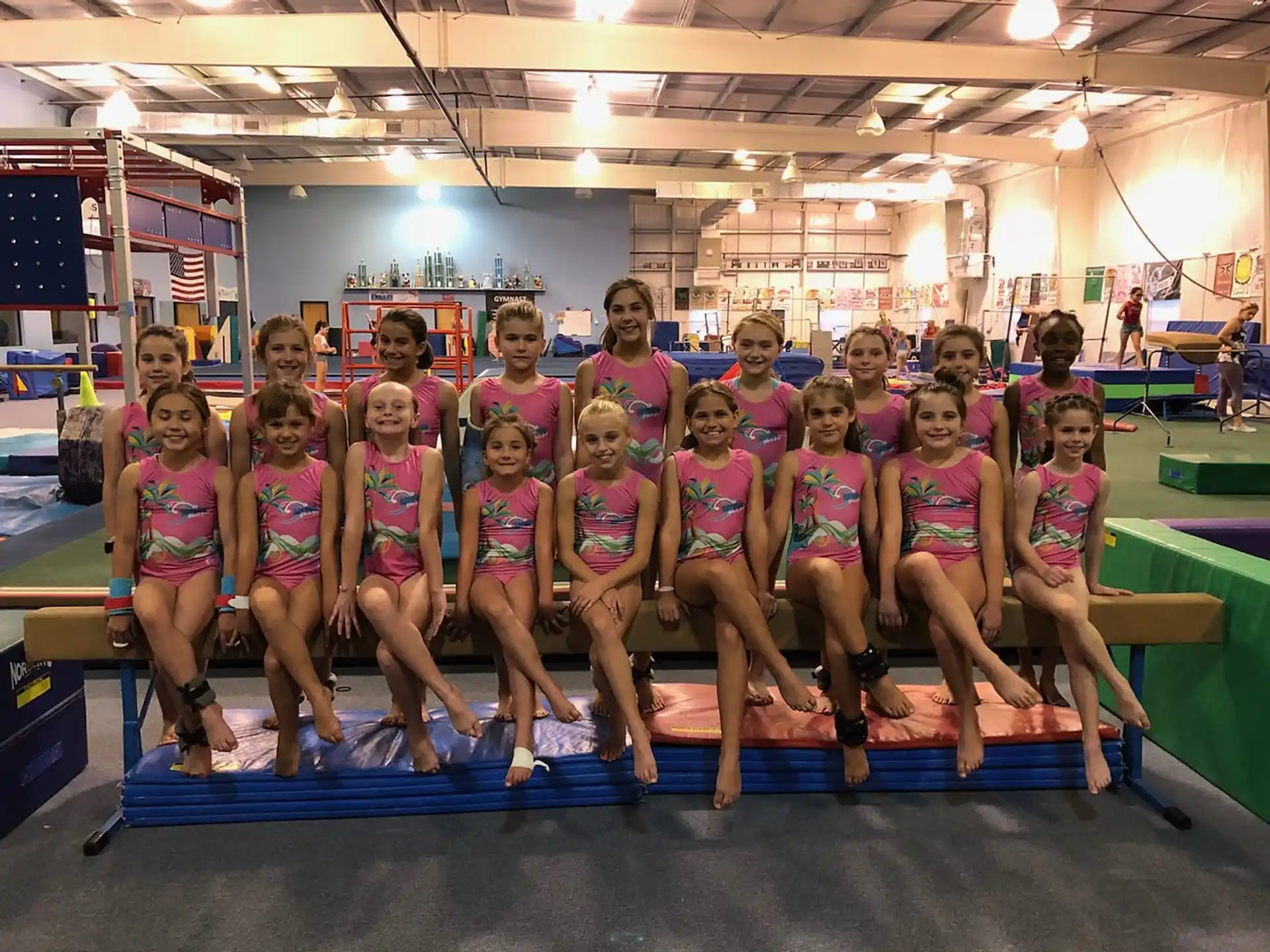 a group of girls in pink shirts