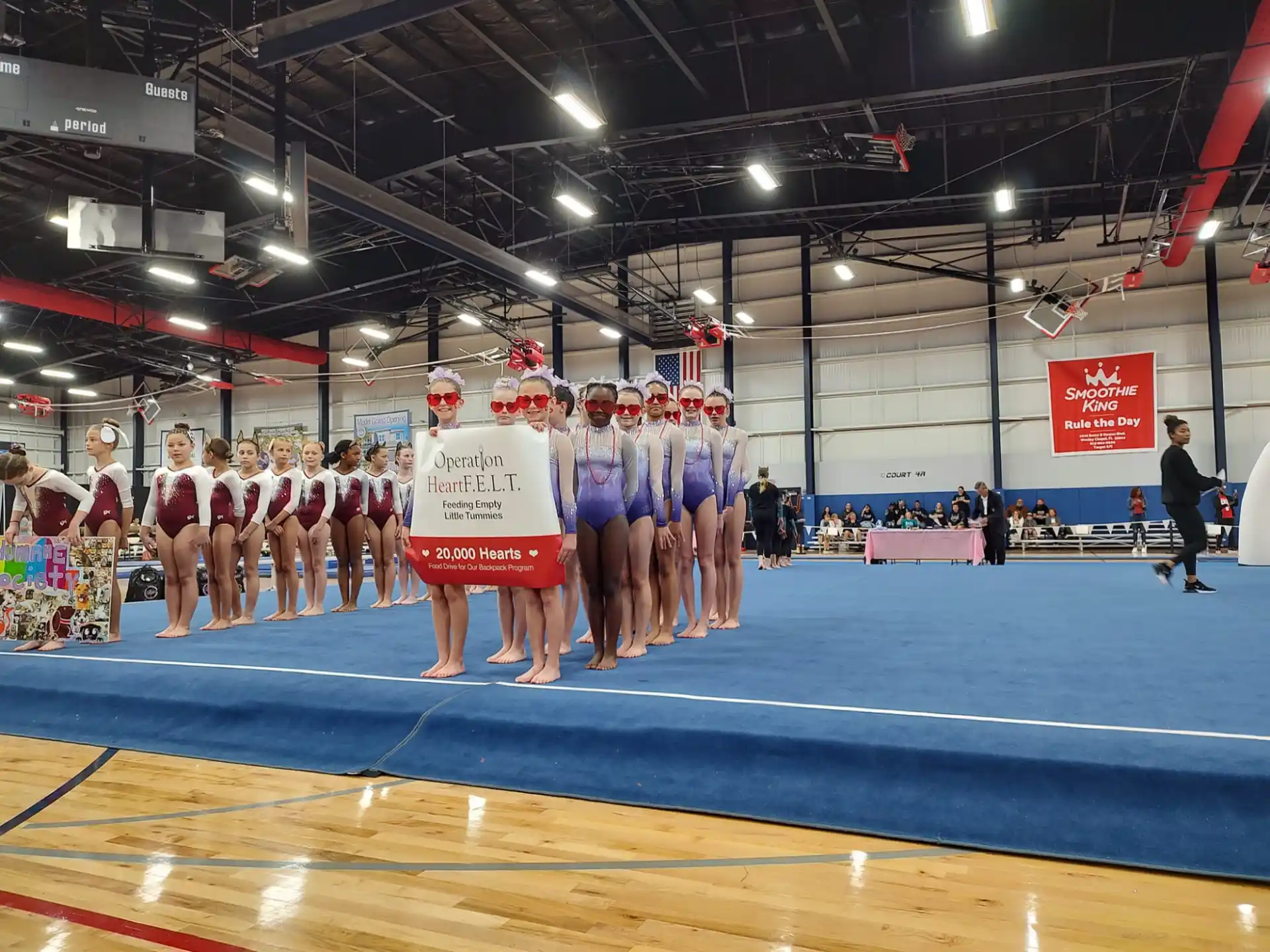 a group of people in a gym