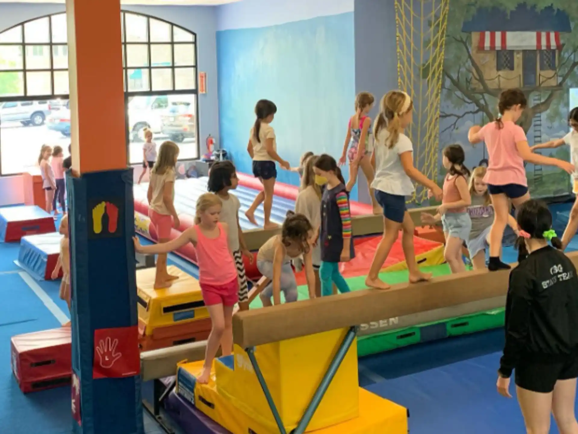a group of children playing on a trampoline