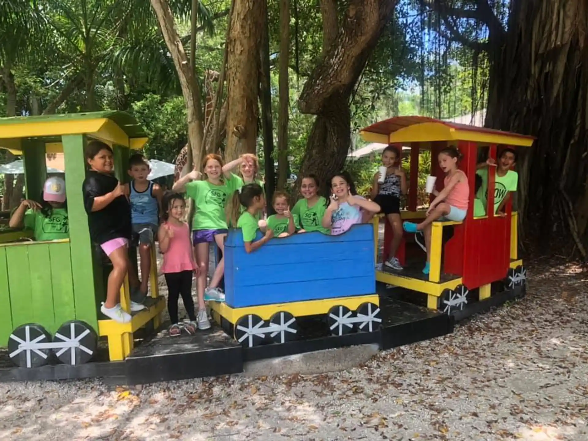 a group of people on a small amusement park ride