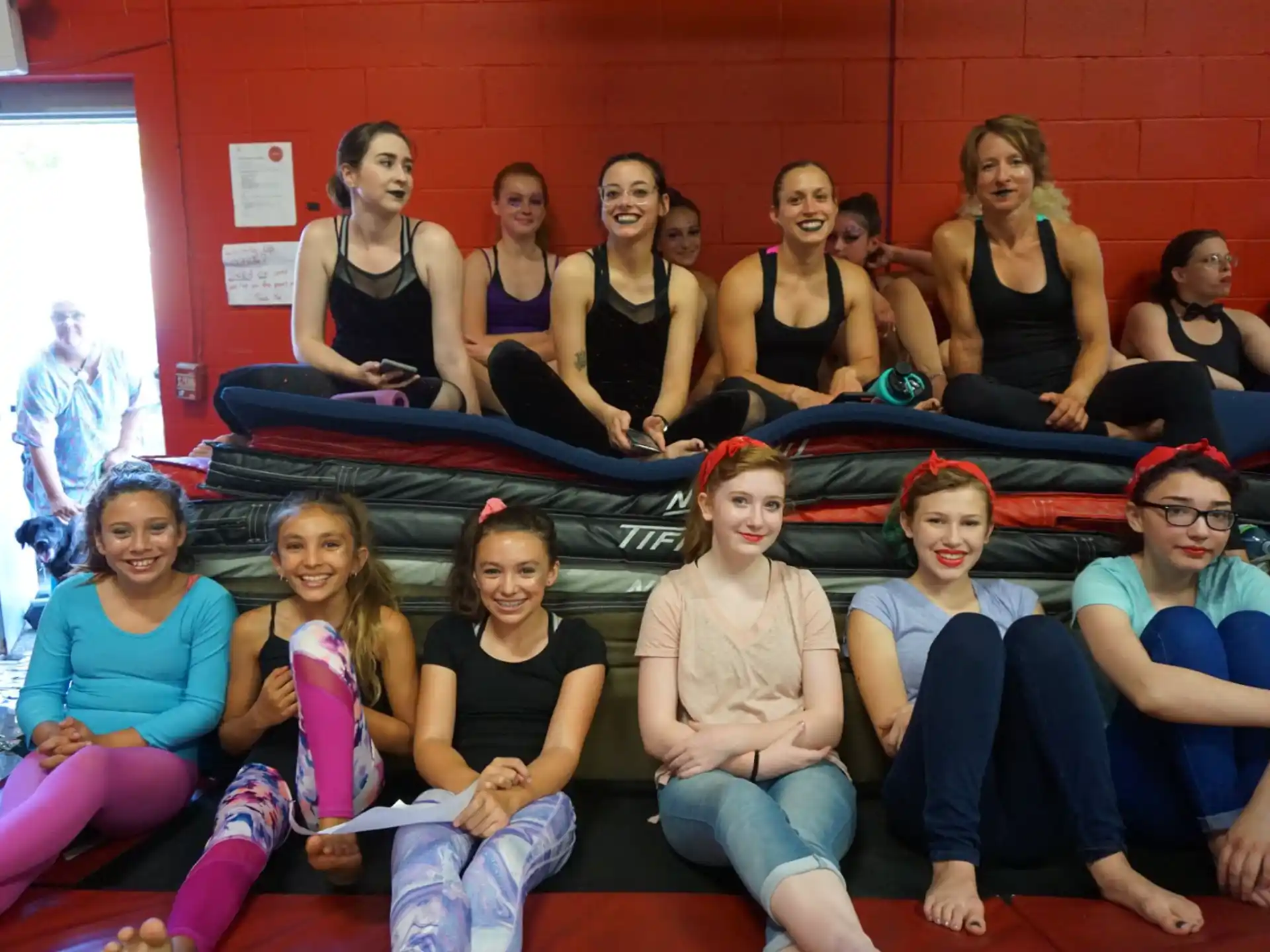a group of women sitting on the floor