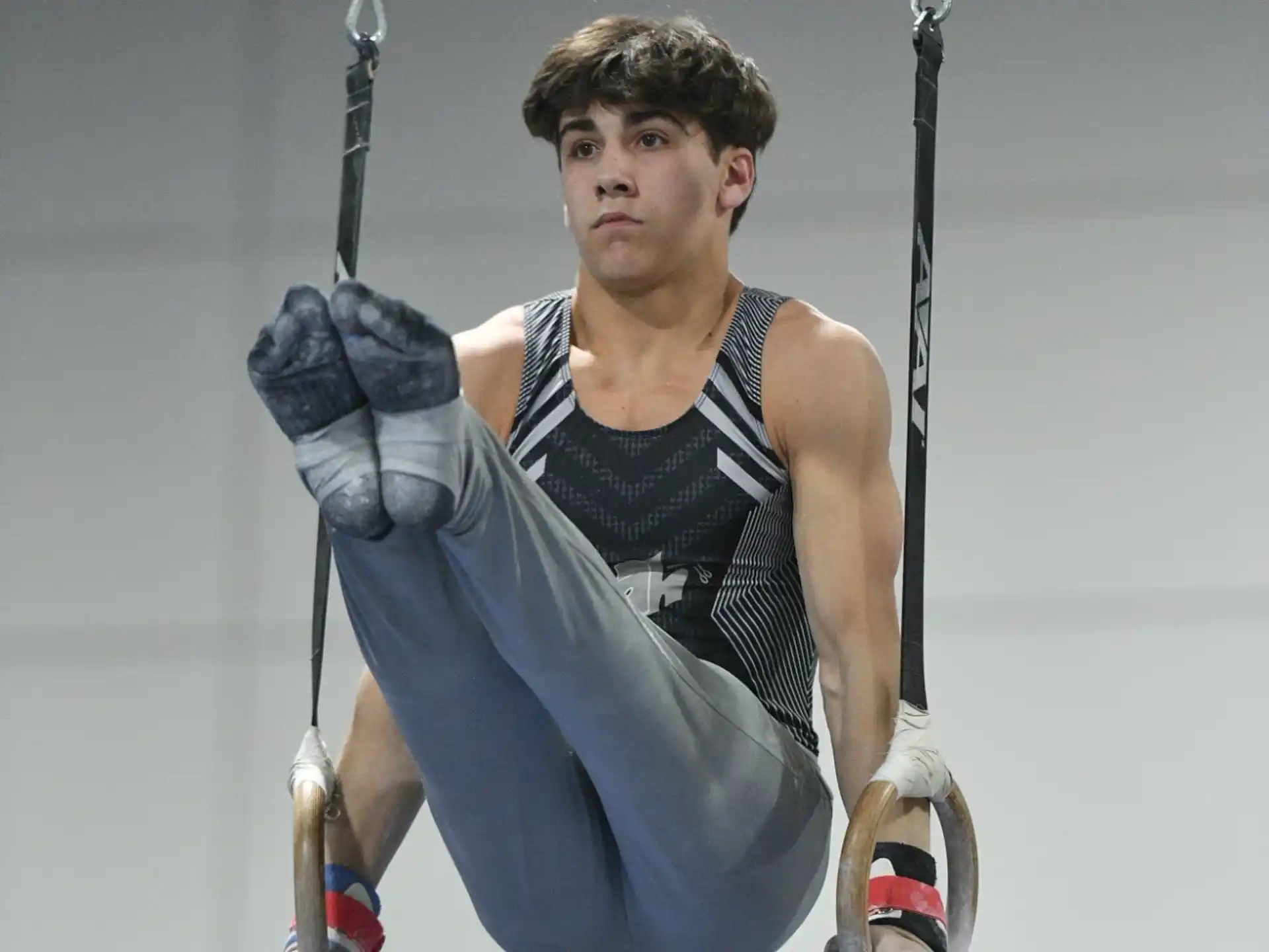 a man holding onto a rope