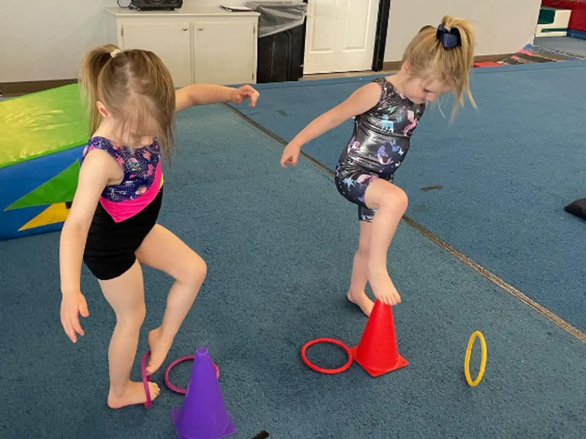 two girls playing with toy blocks