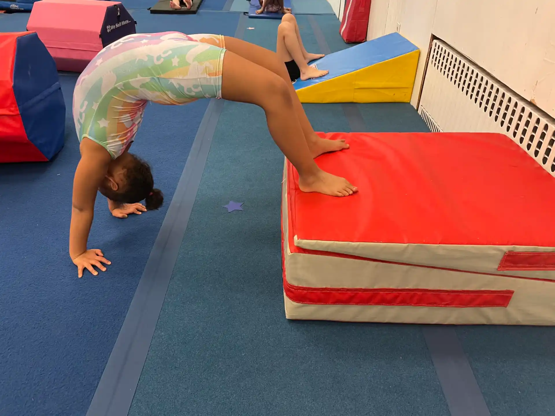 a person lying on a mat