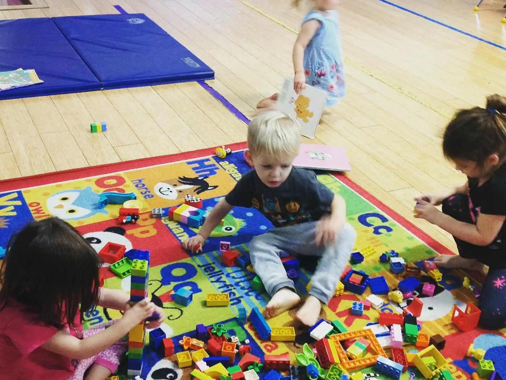children playing on a colorful mat