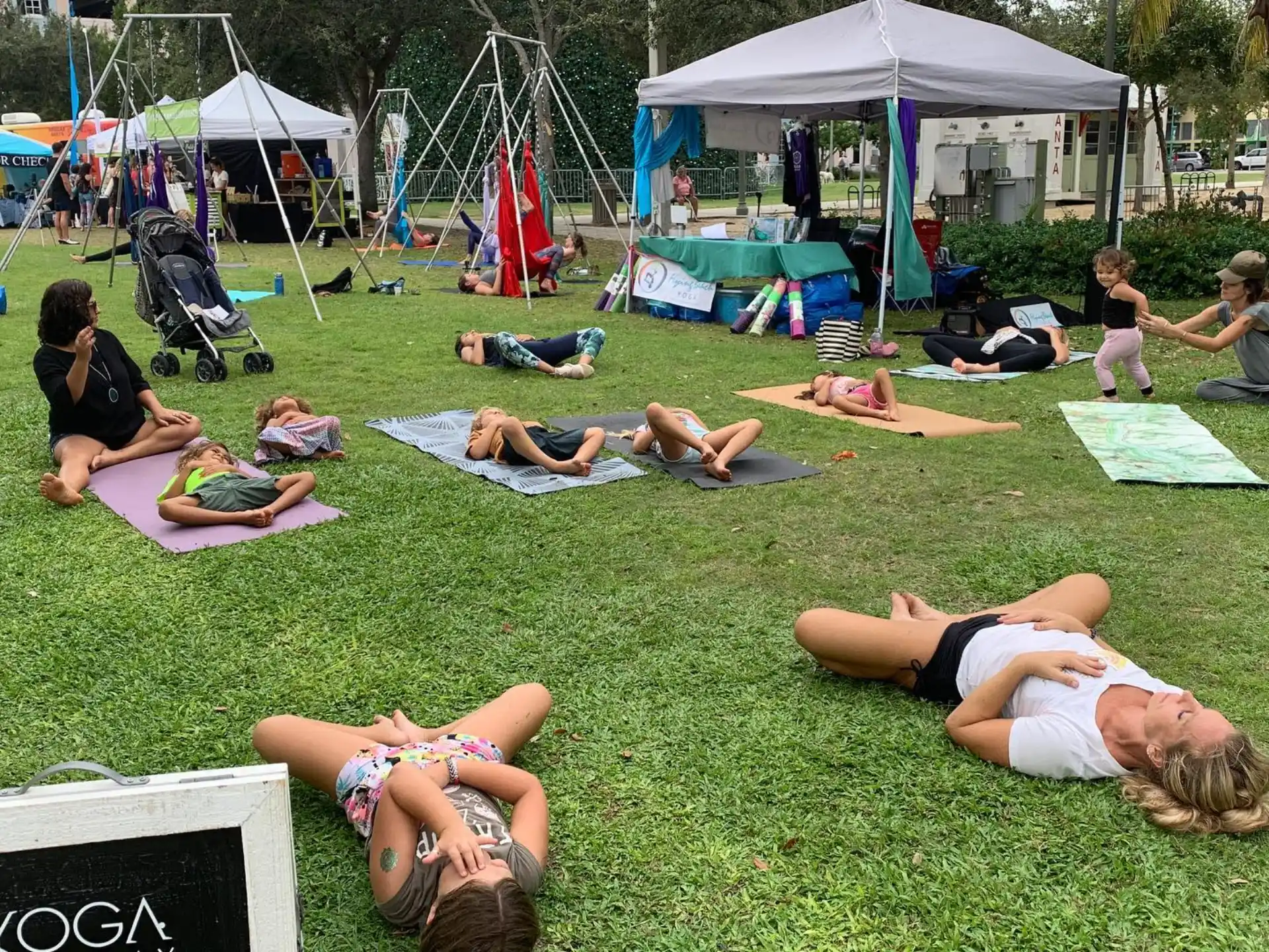 a group of people lying on the grass
