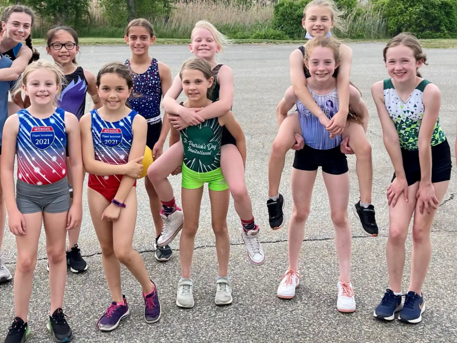a group of women wearing running clothes