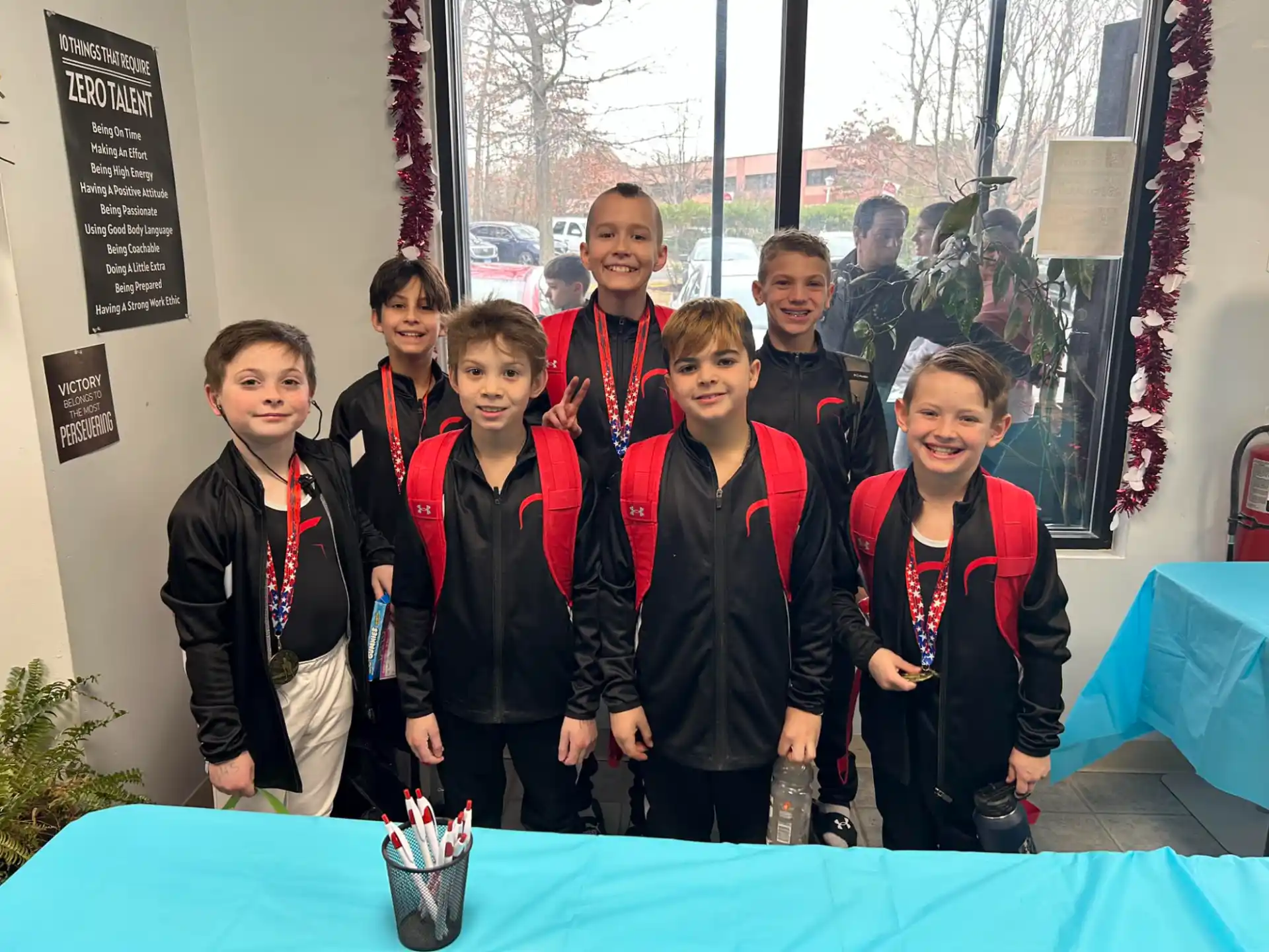 a group of boys wearing medals