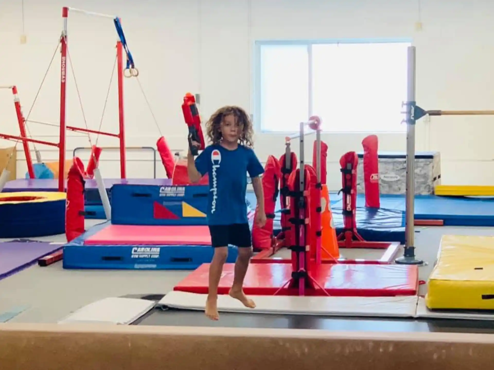 a girl standing on a mat