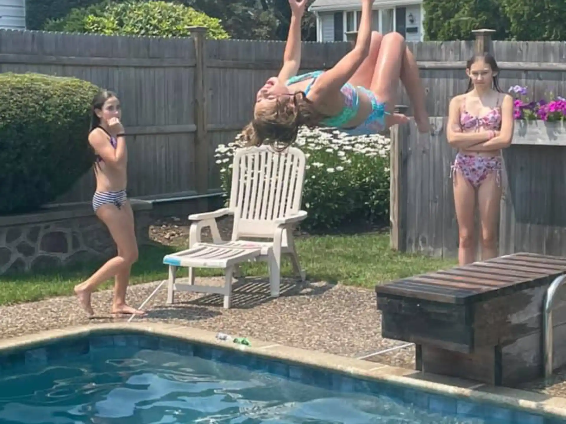 a person jumping into a pool