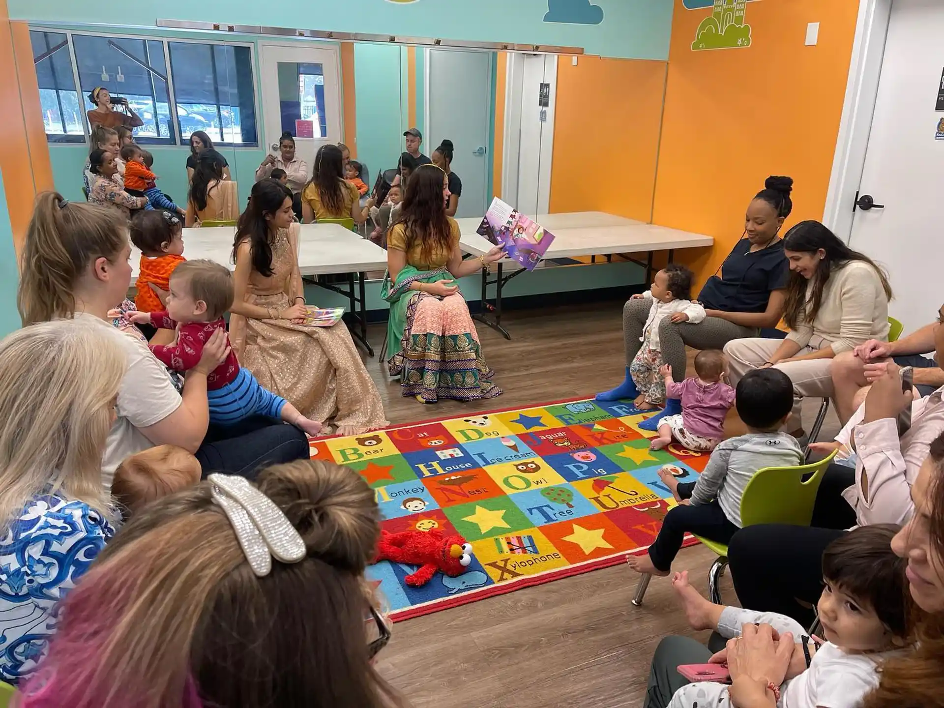 a group of children sitting in a circle in a room