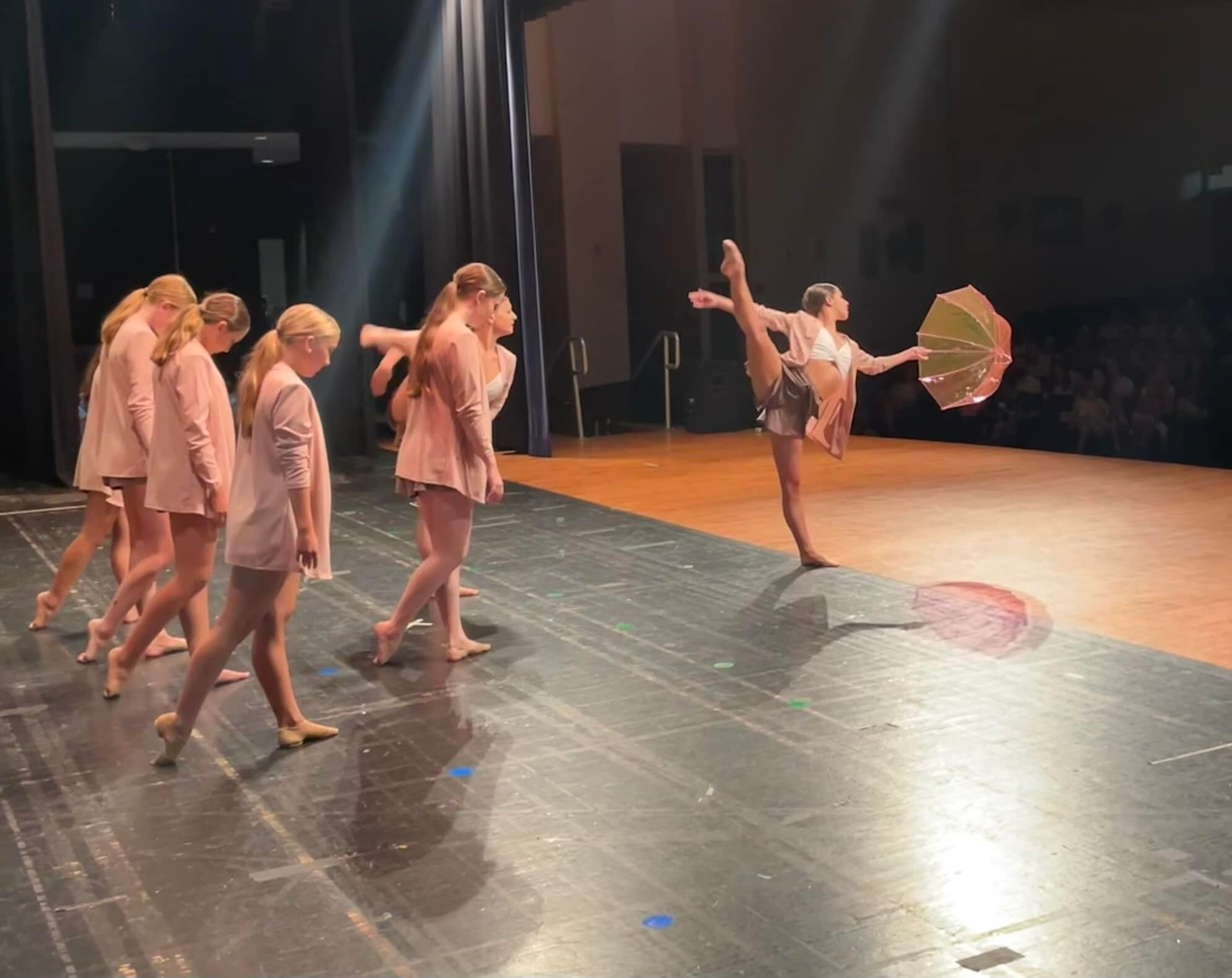 a group of women dancing on a stage