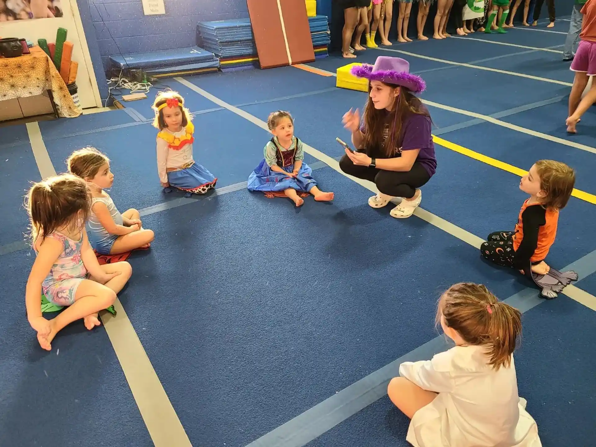 a group of children sitting on the floor
