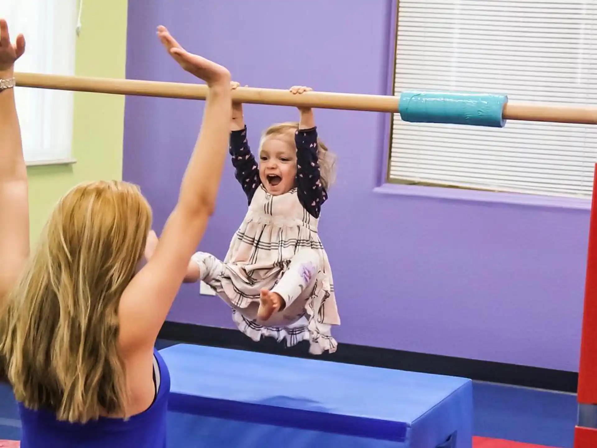a girl with her arms raised