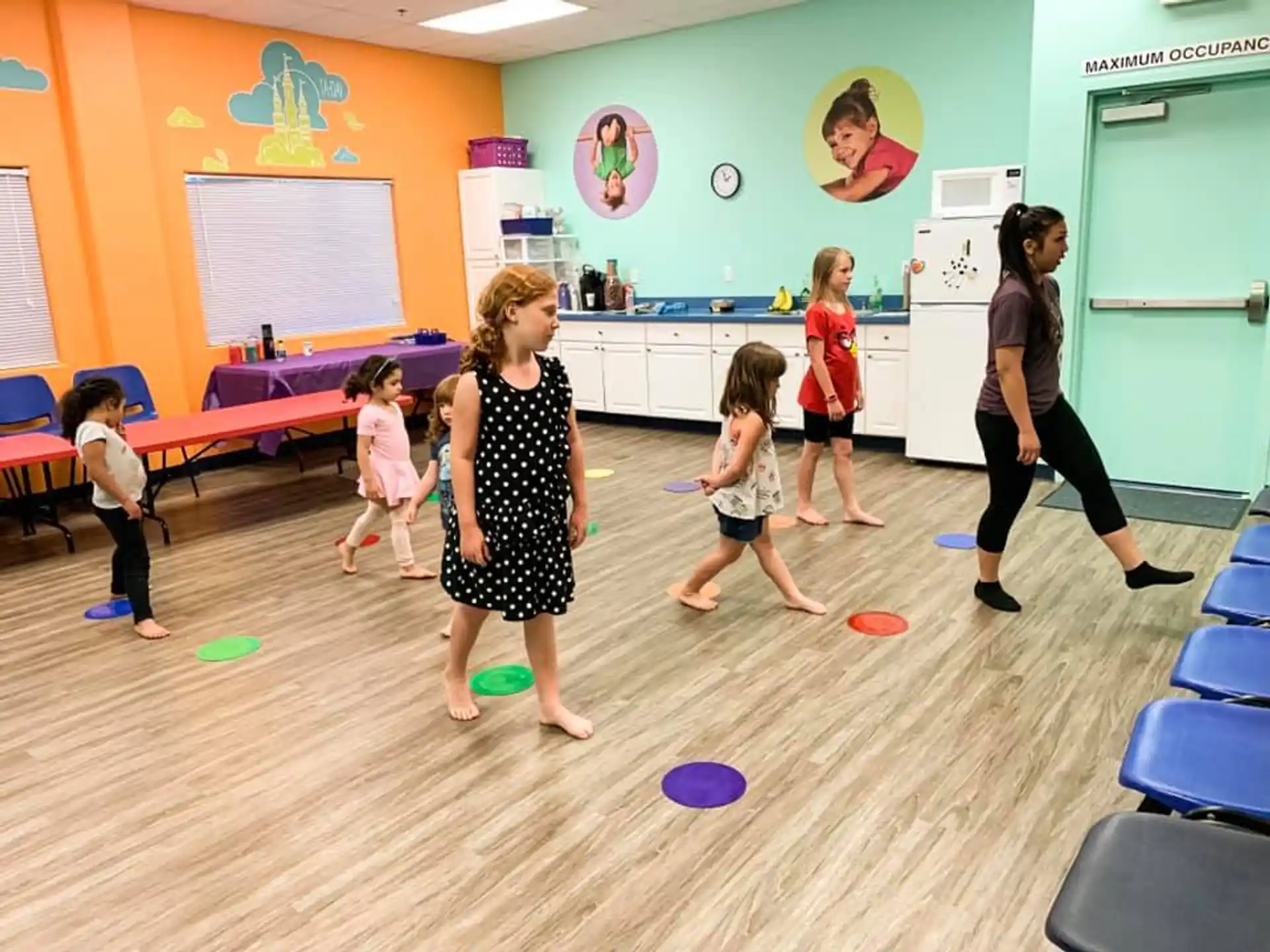 a group of children playing in a room