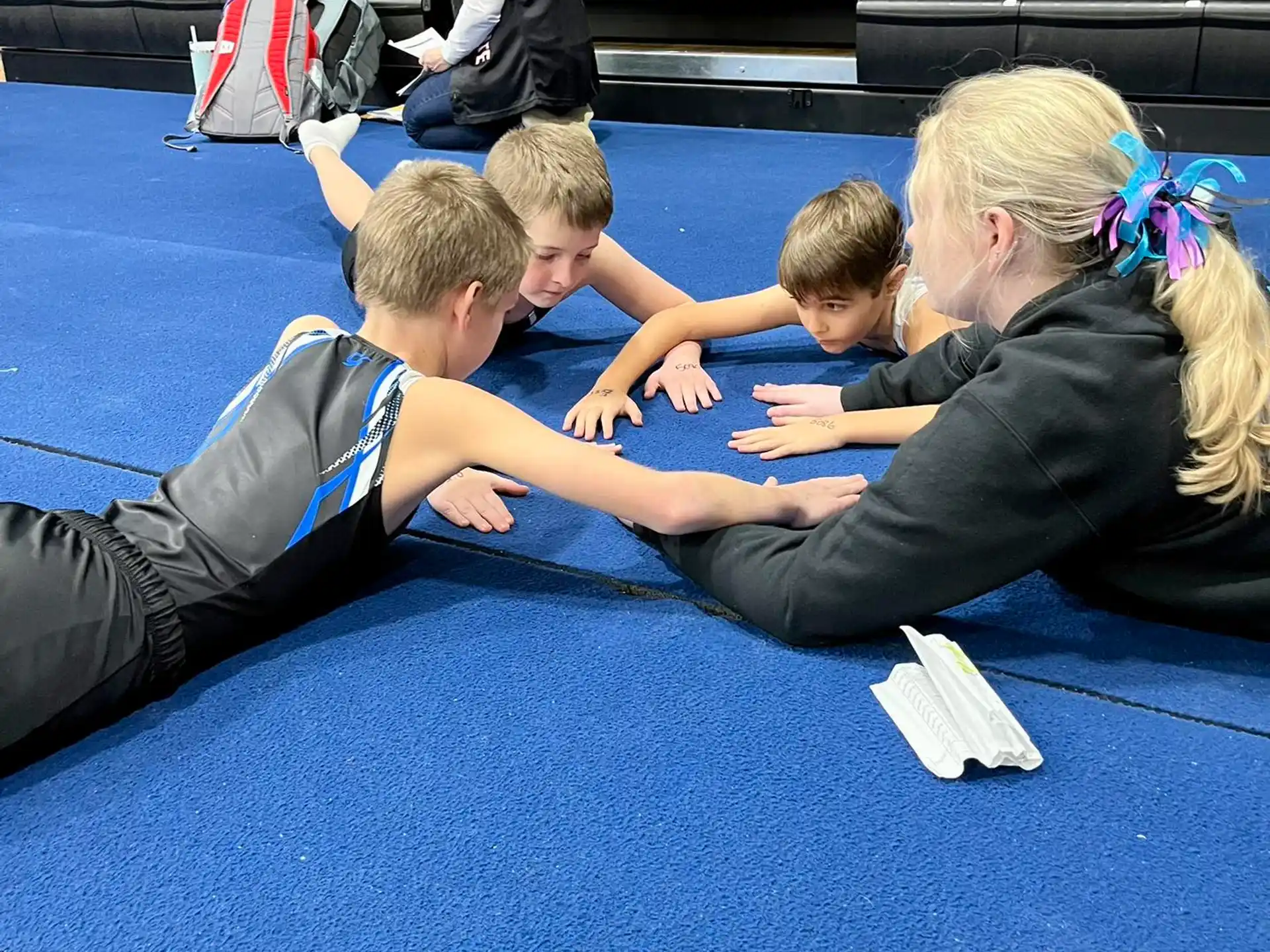 a group of children playing on a mat