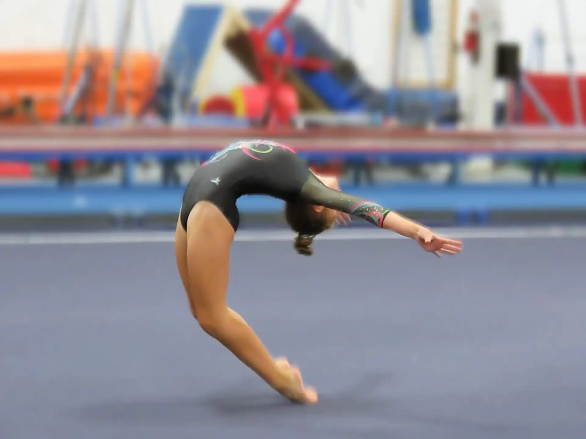 a woman doing a gymnastics trick