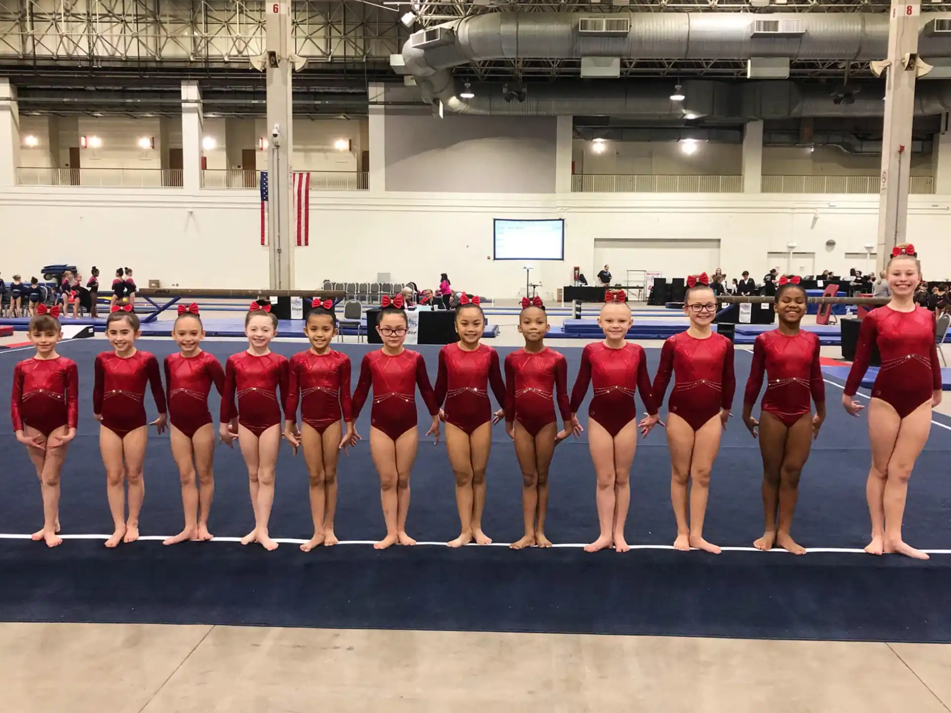 a group of women in red uniforms