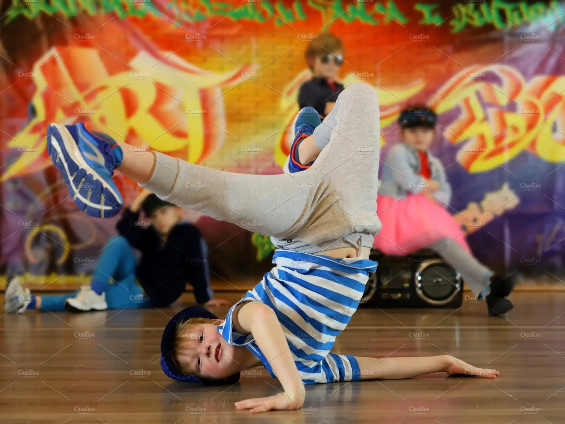 a person doing a handstand on a stage
