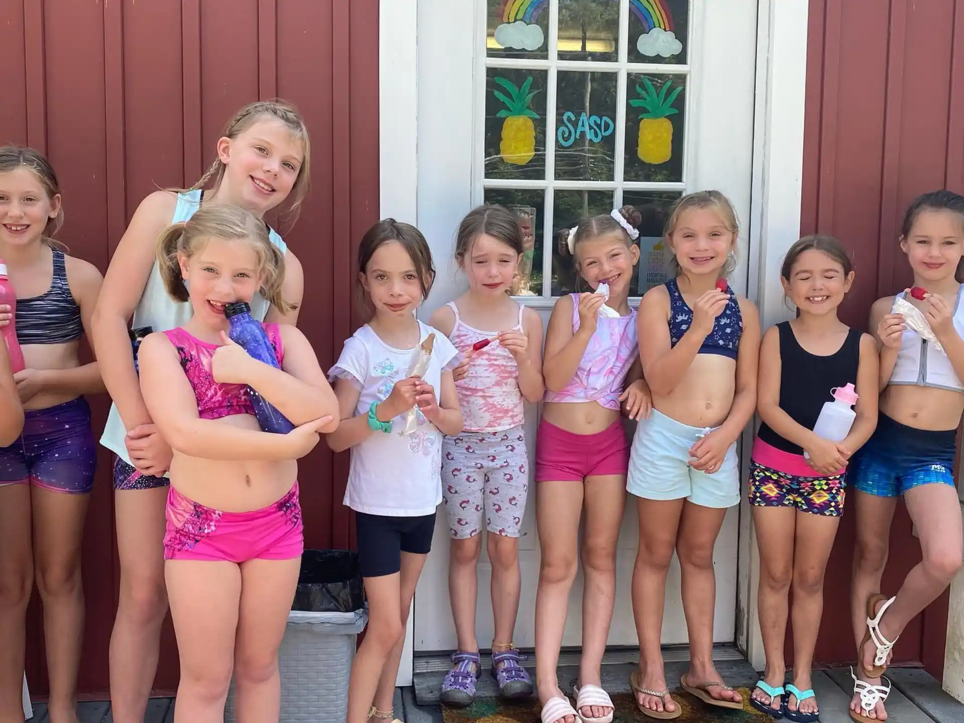 a group of girls posing for a photo