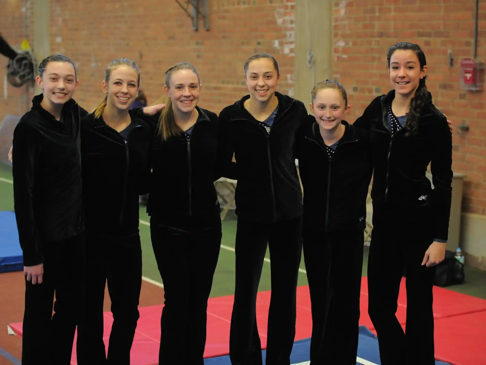 a group of women in black