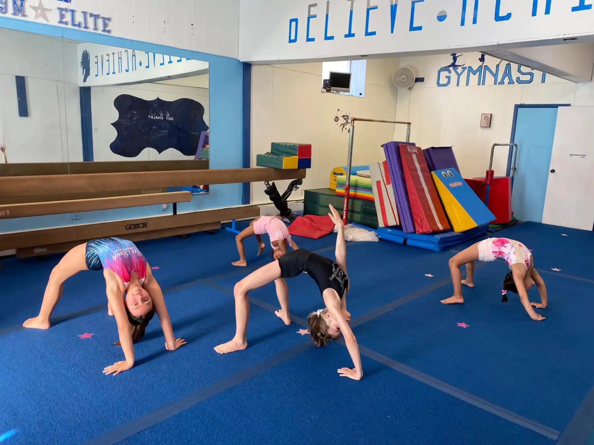 a group of children doing yoga