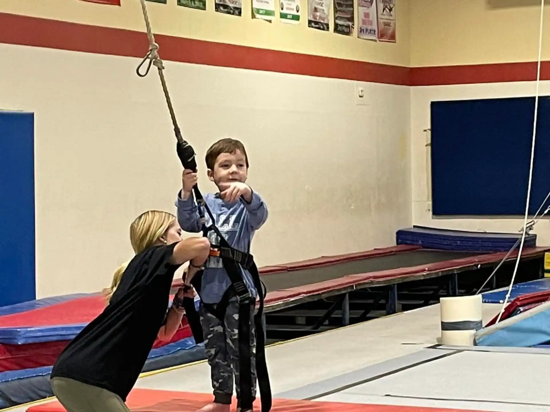 a boy and a girl practicing archery