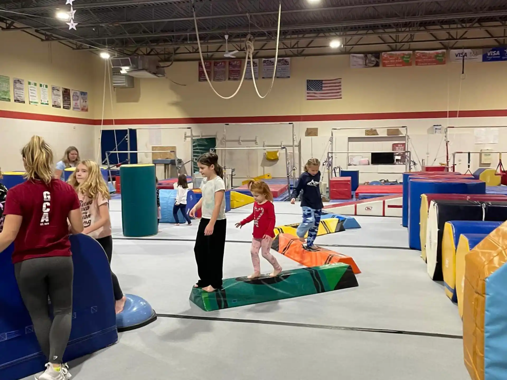 a group of people exercising in a gym