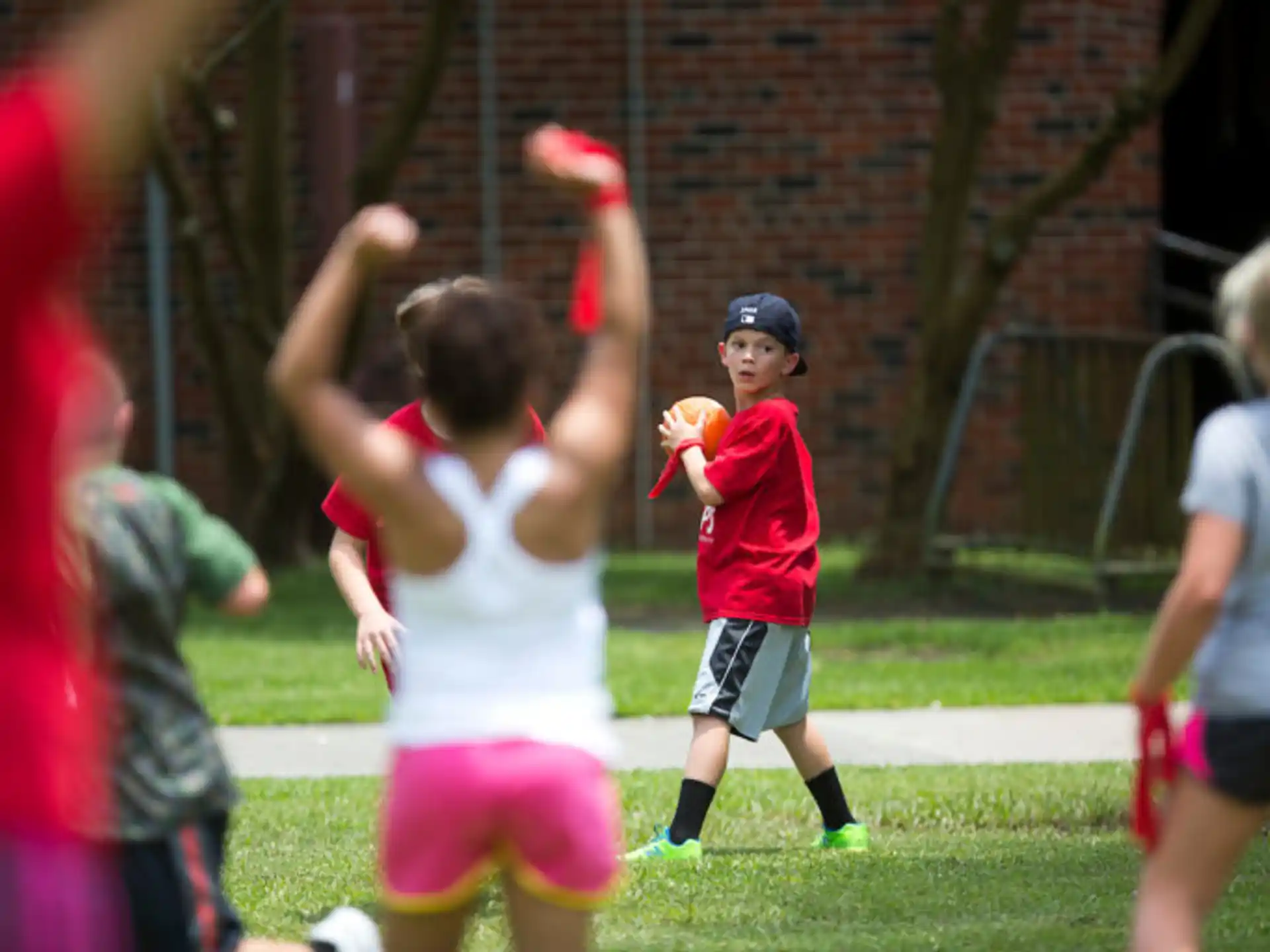 a group of children playing in a field
