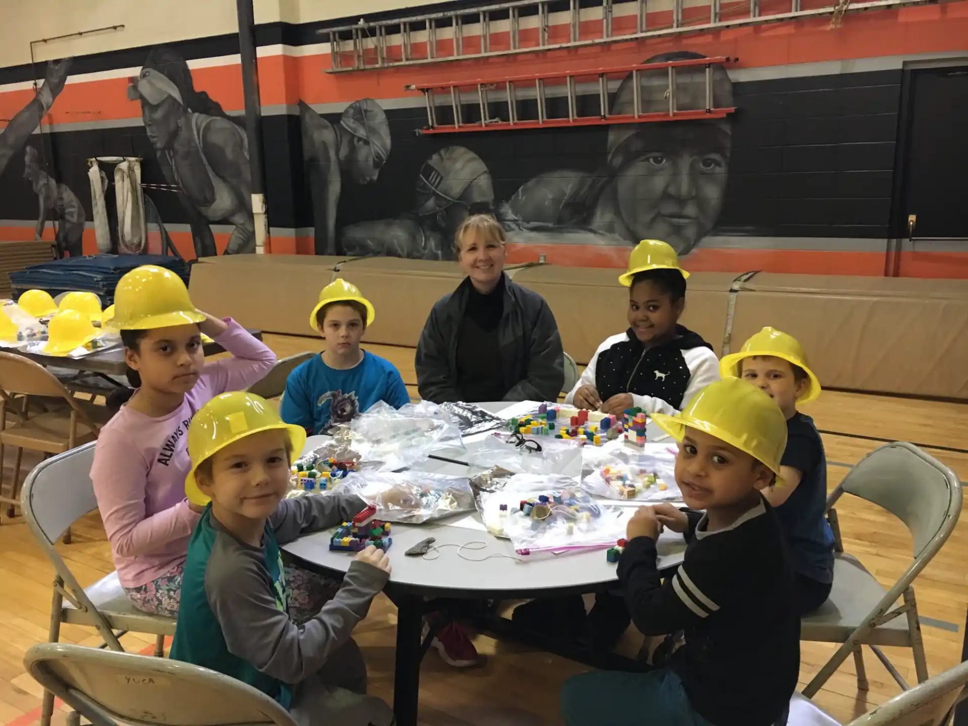a group of people sitting at a table with food
