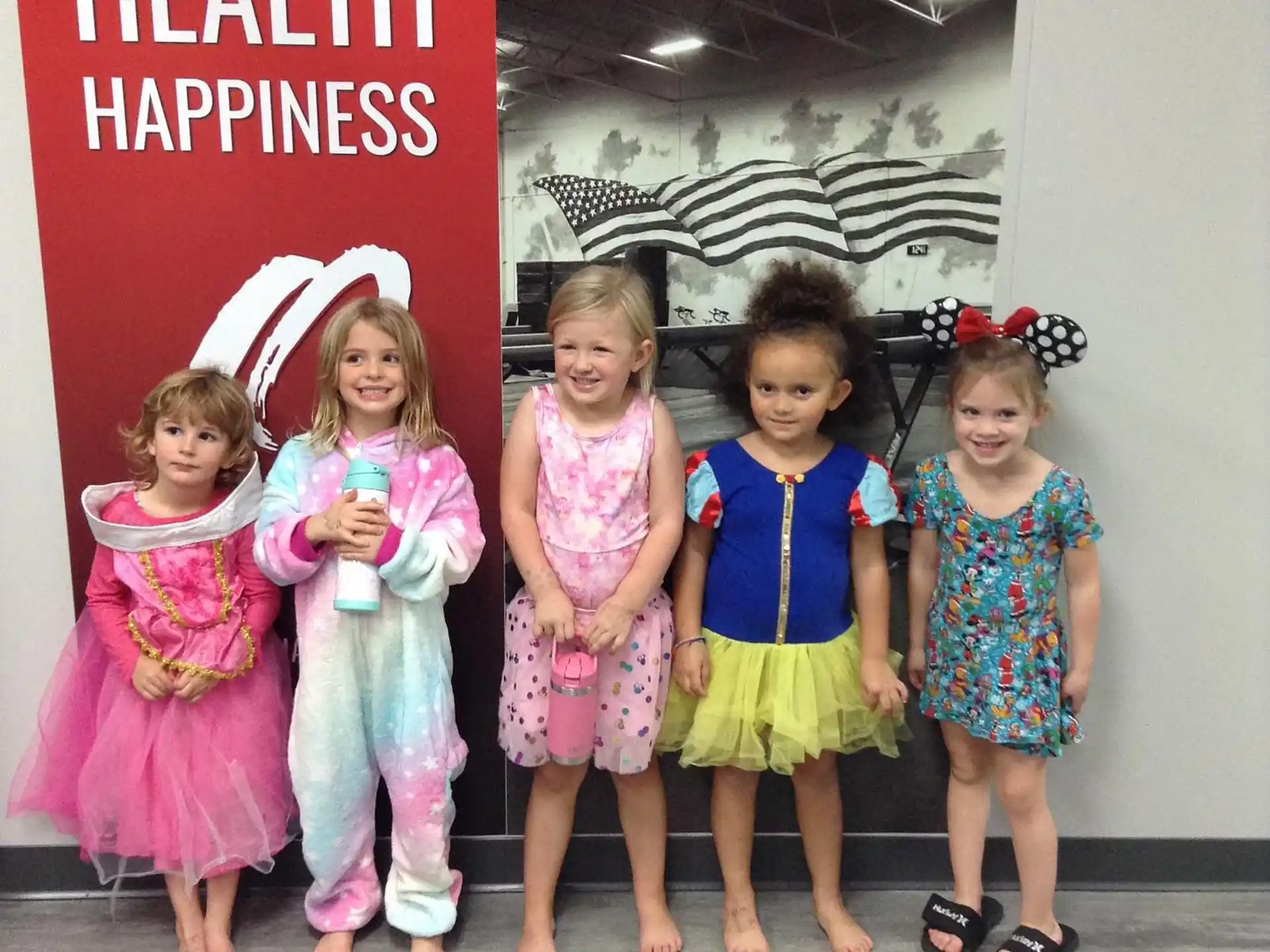 a group of girls posing for a photo