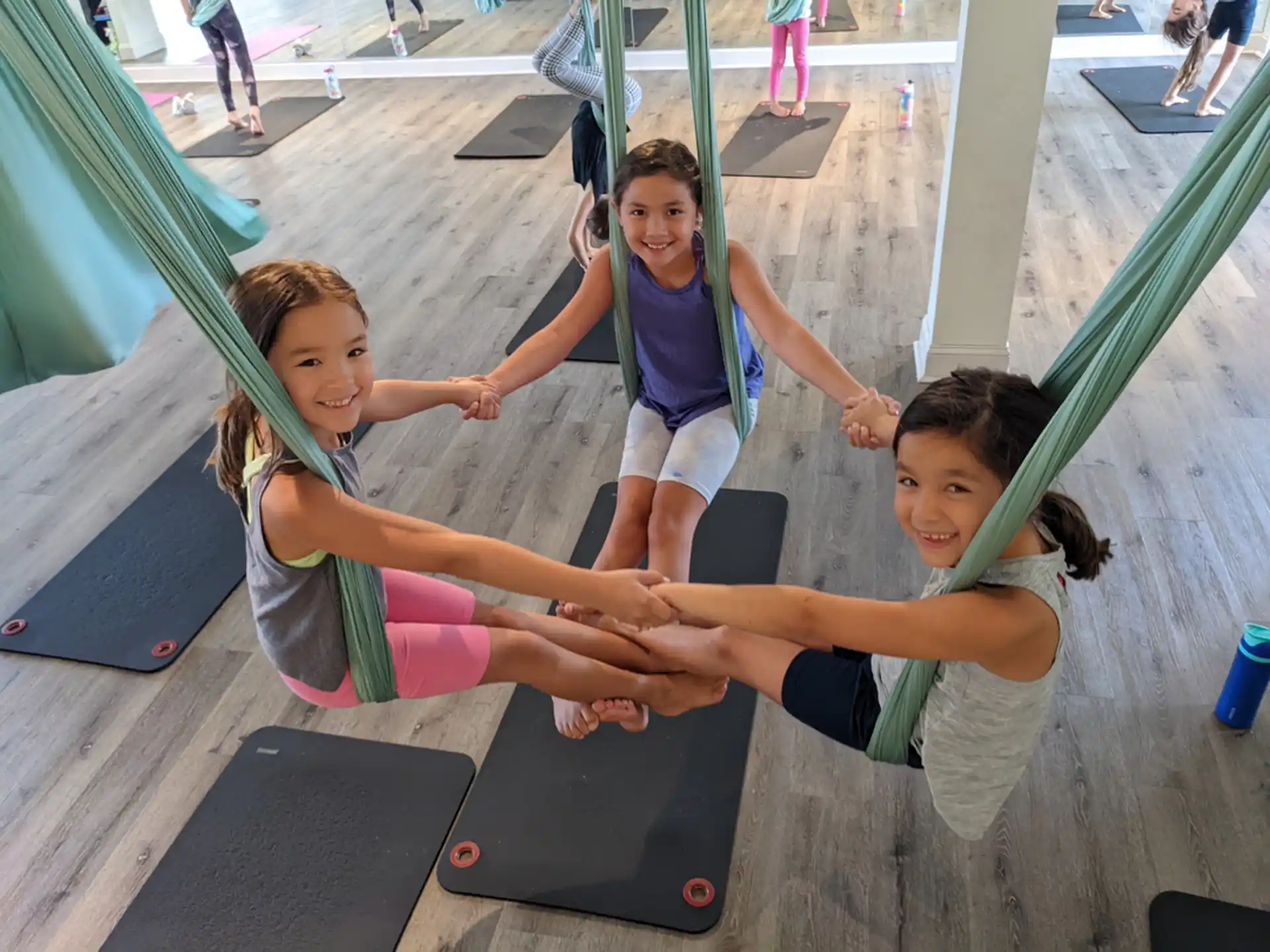 a group of kids playing on a trampoline