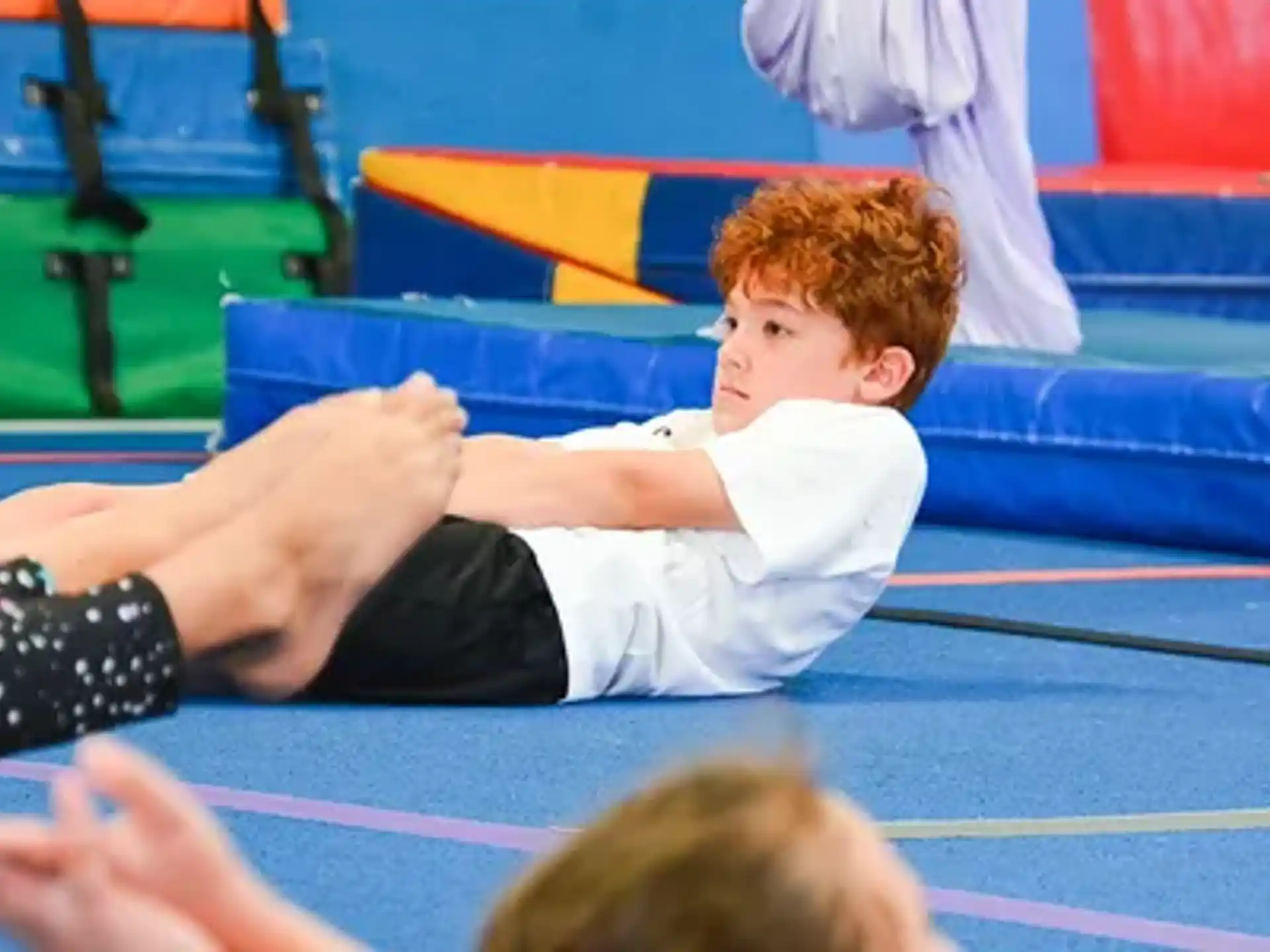 a boy lying on the ground