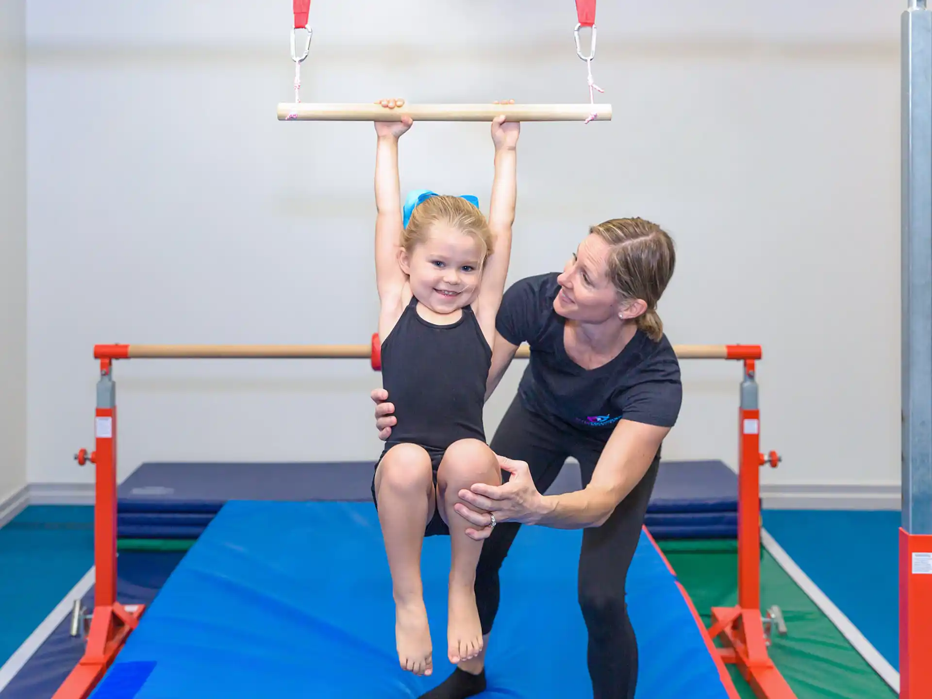 a person and a child on a bar