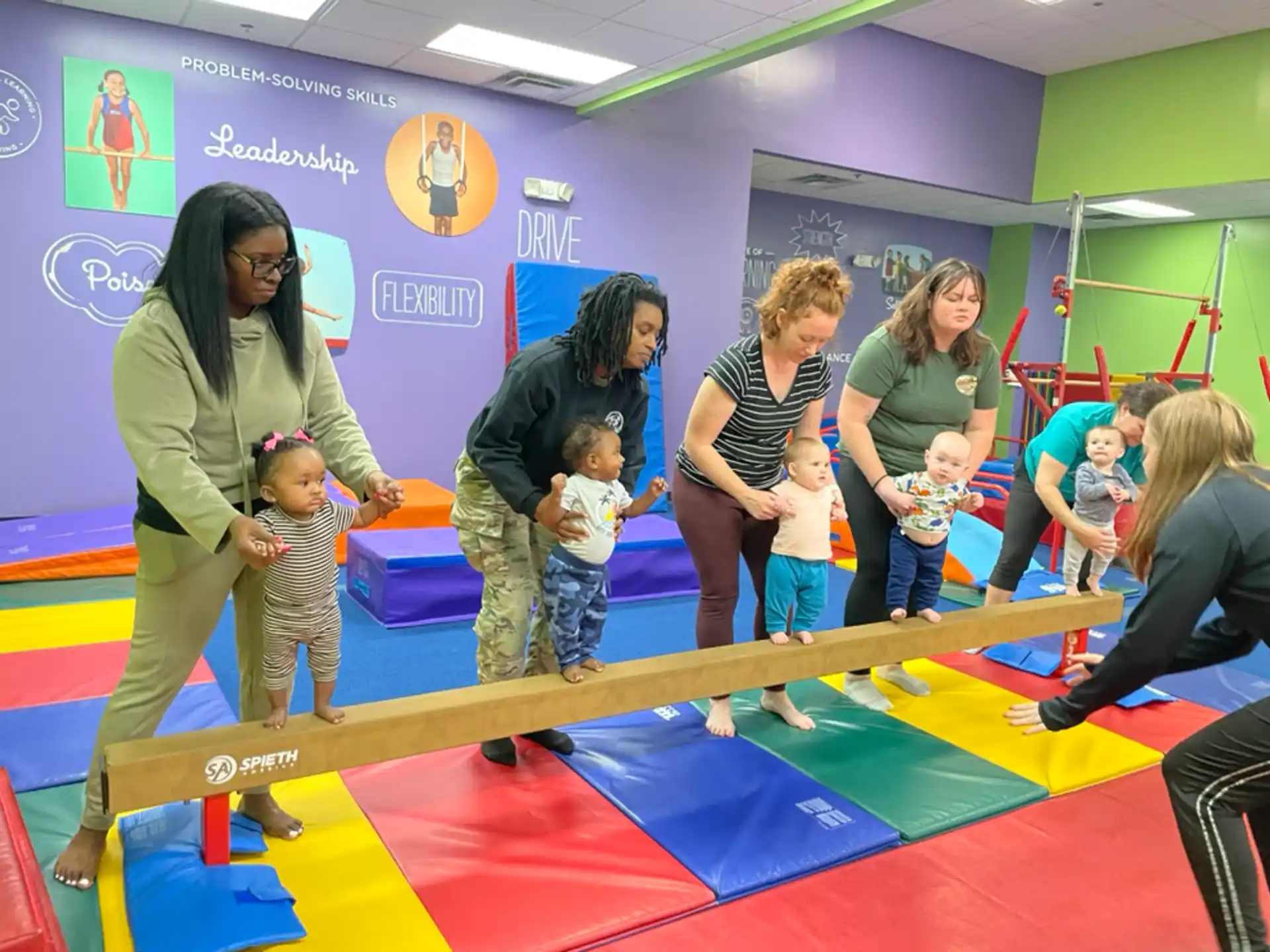 a group of people playing on a mat