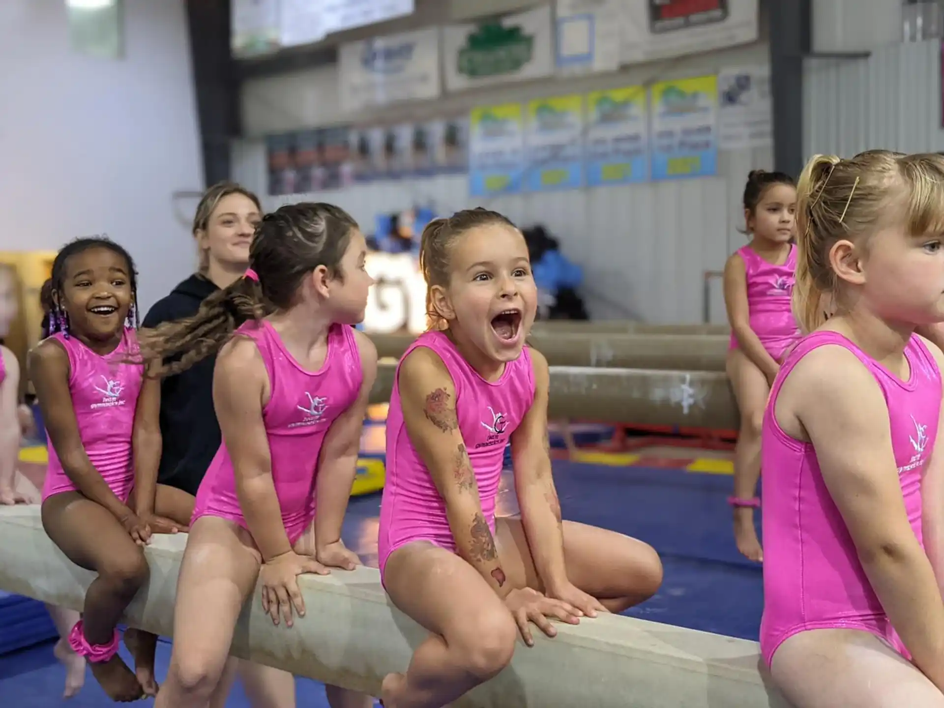 a group of girls in pink uniforms