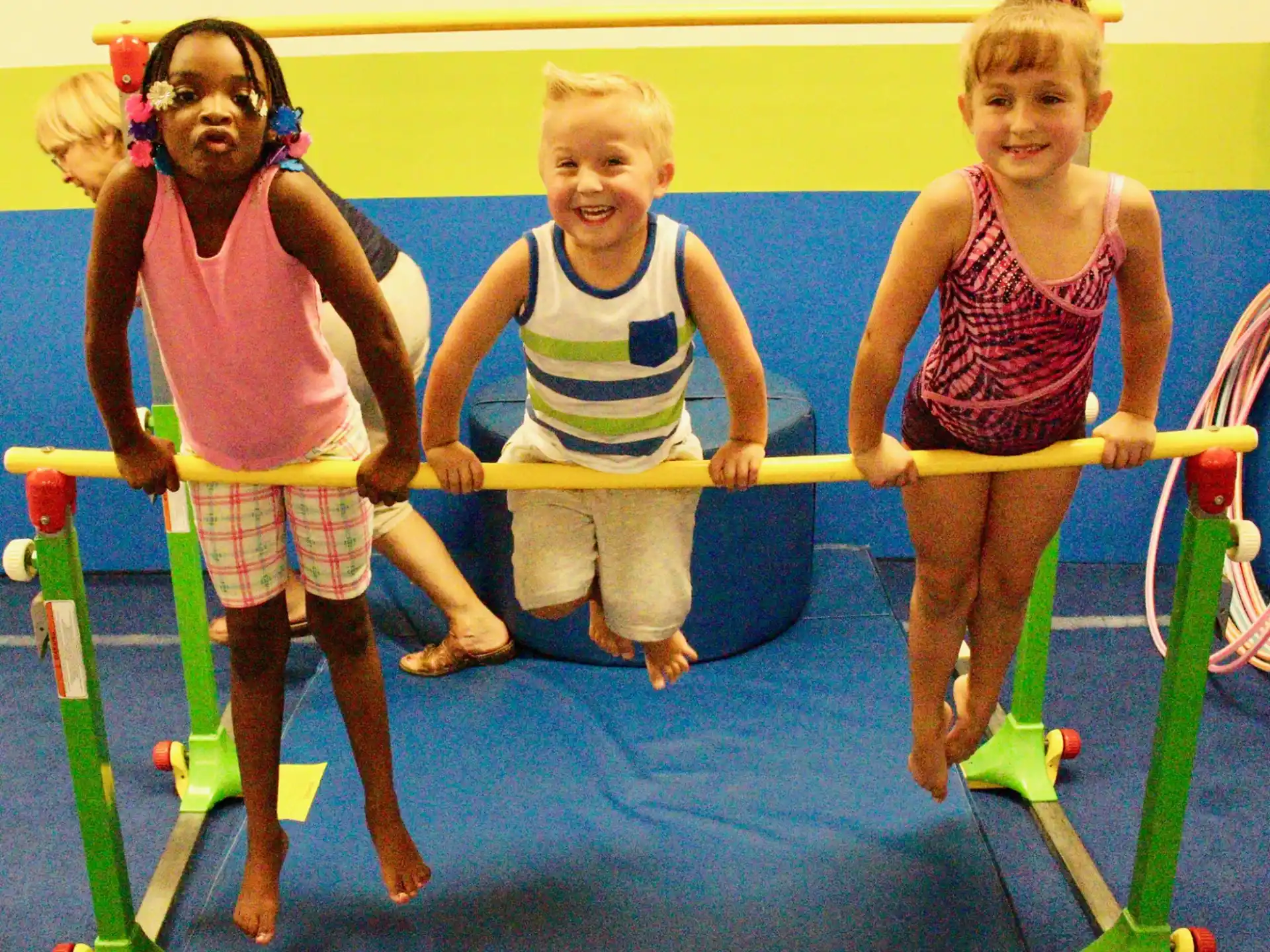 a group of children playing on a trampoline
