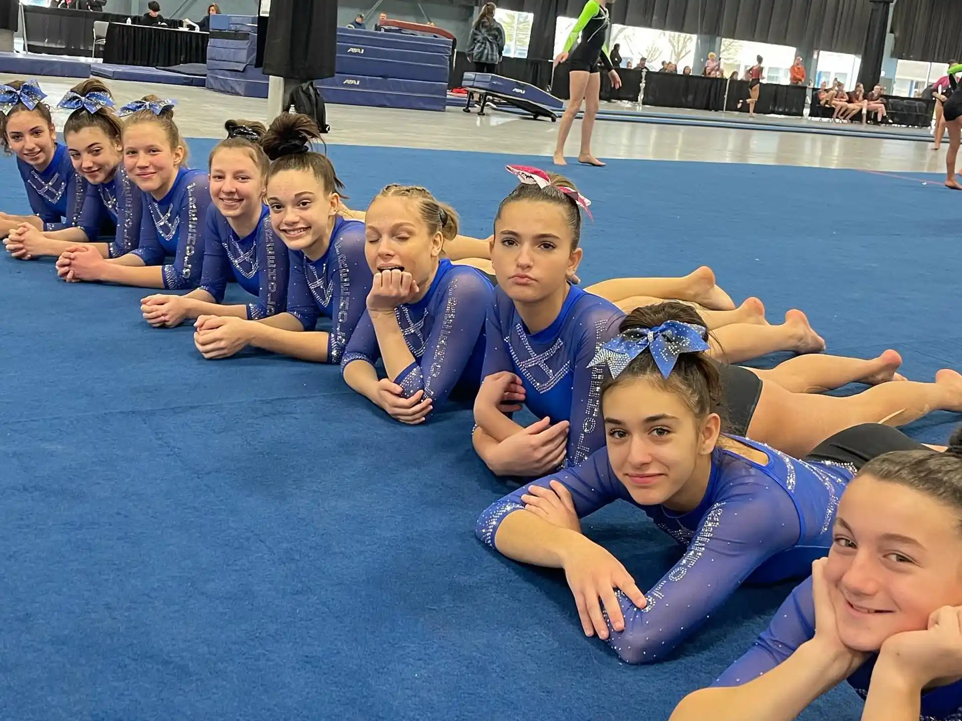 a group of girls in blue uniforms
