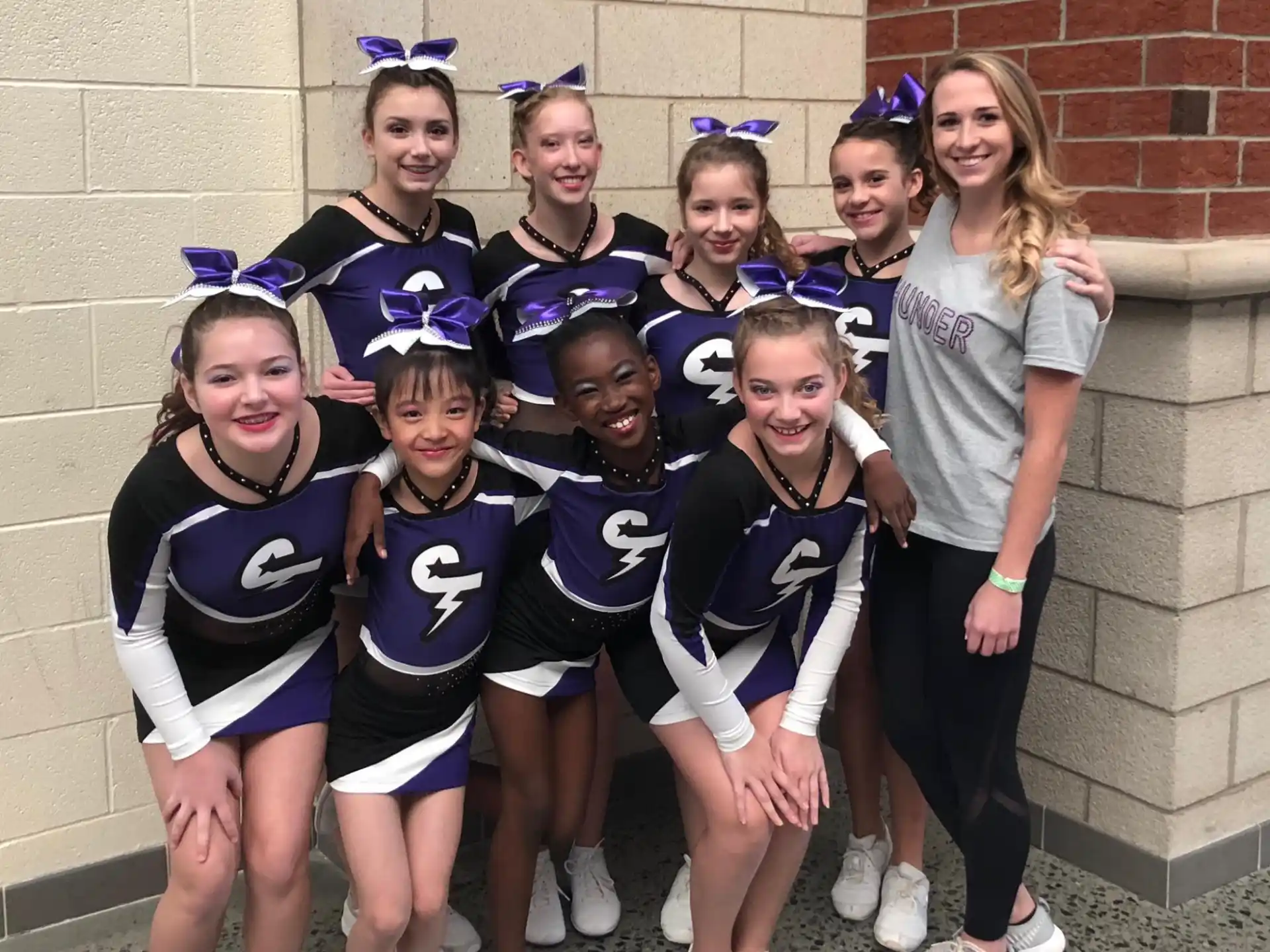 a group of girls in cheerleader uniforms