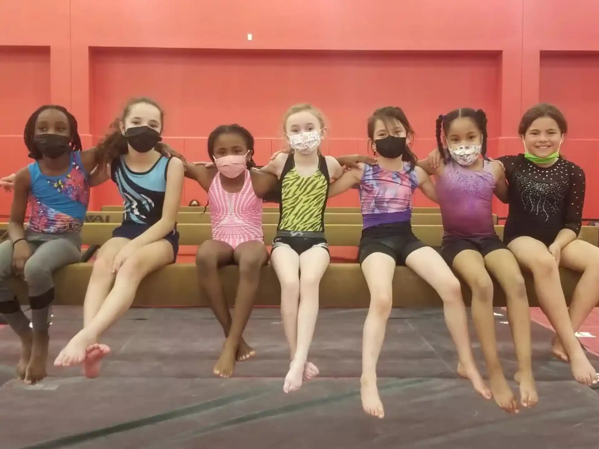 a group of girls posing for a photo