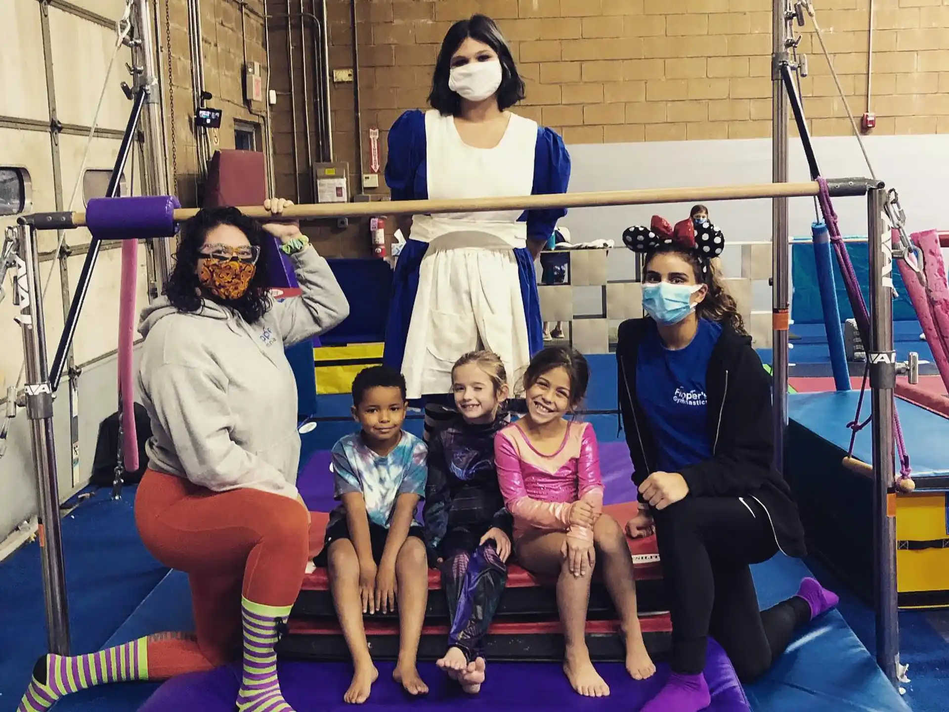 a group of people wearing masks