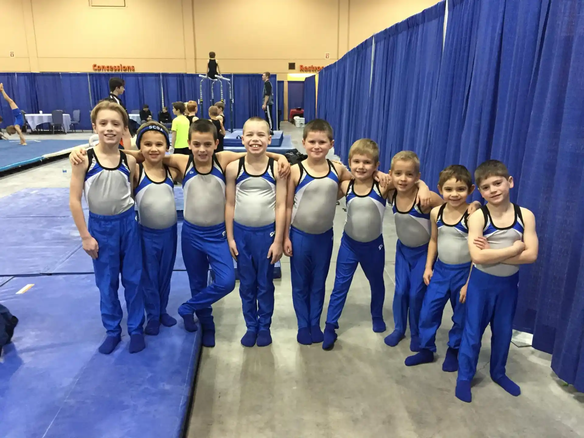 a group of girls in blue uniforms