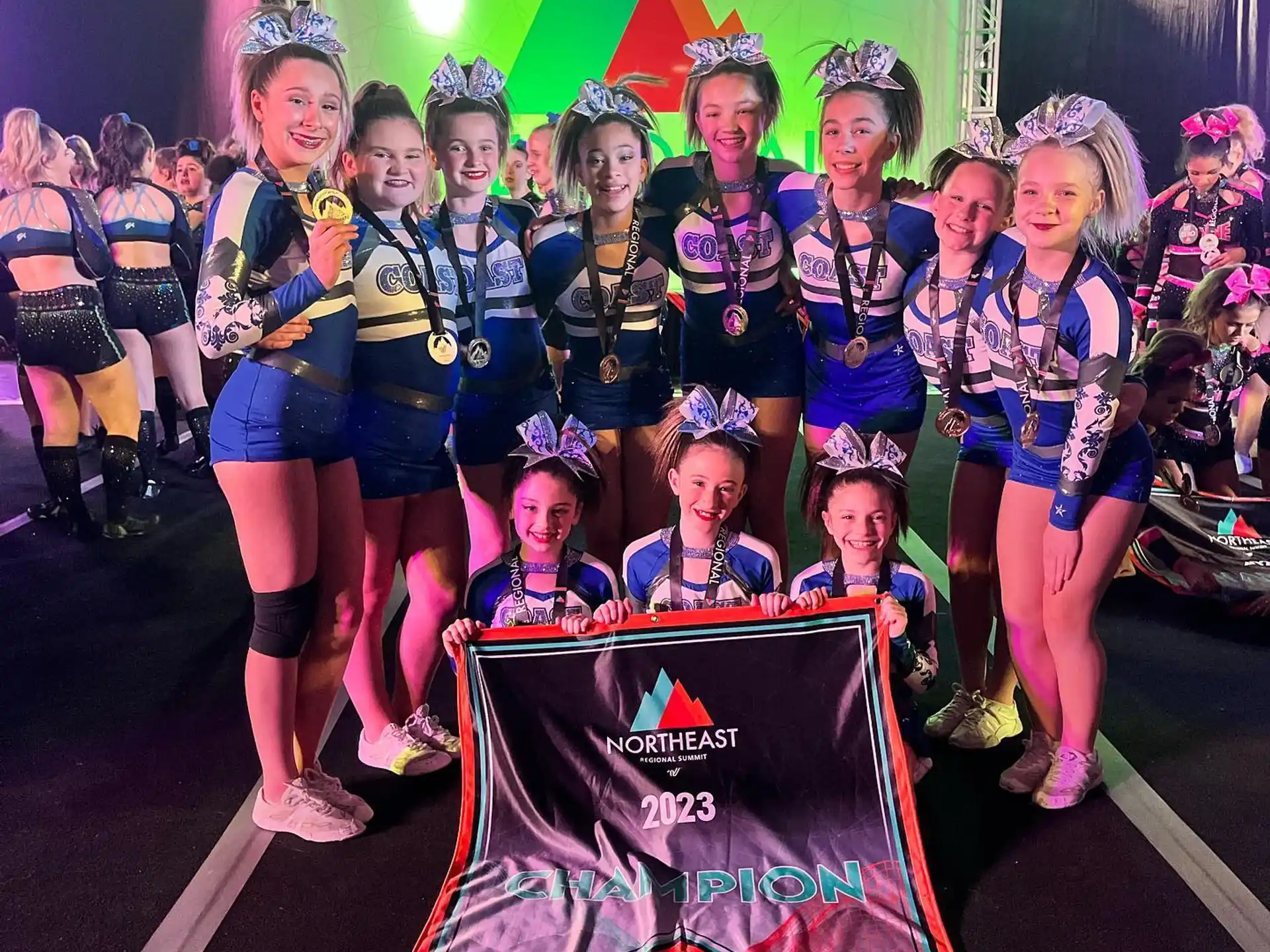 a group of cheerleaders posing for a photo