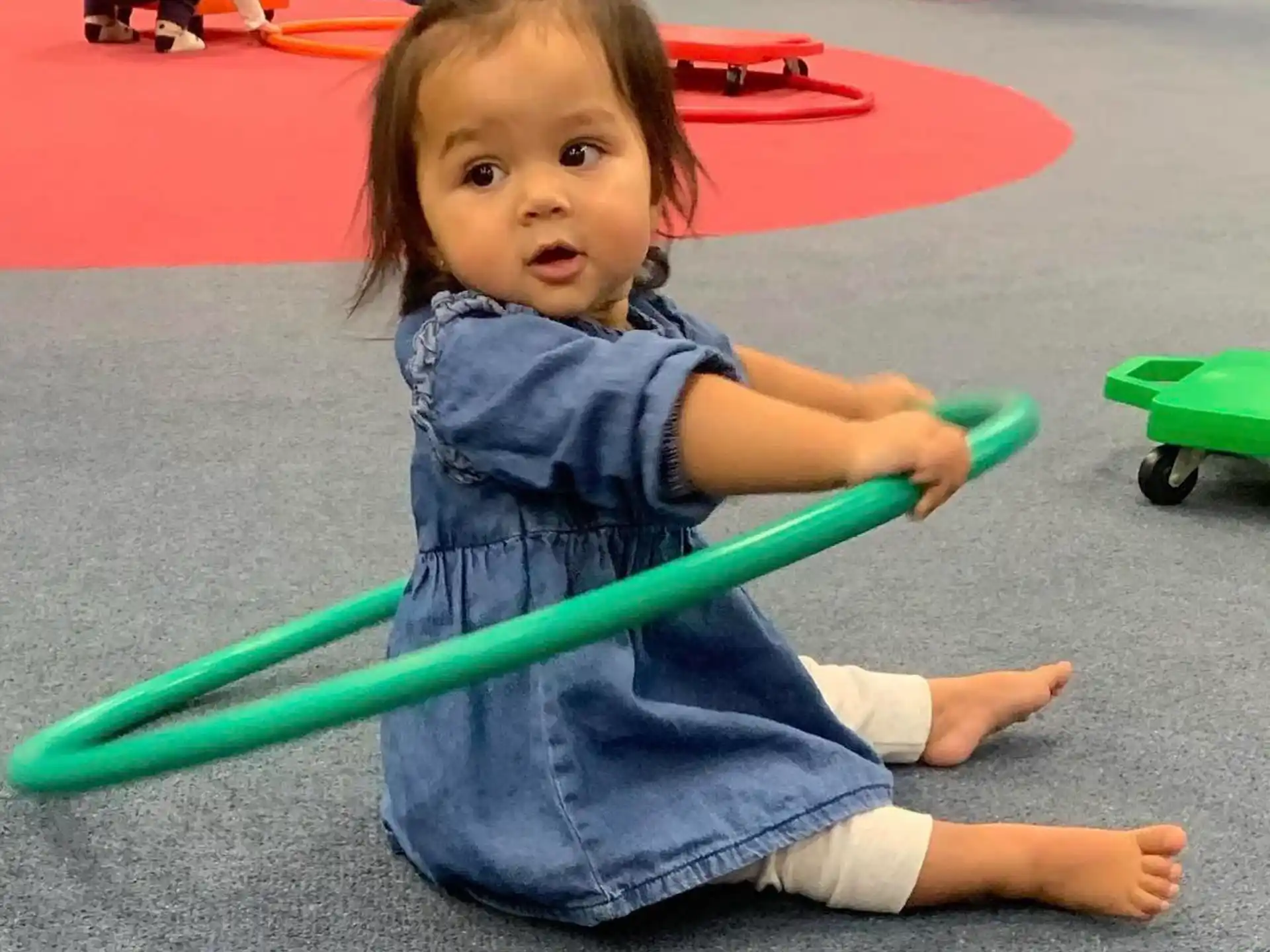 a baby holding a toy