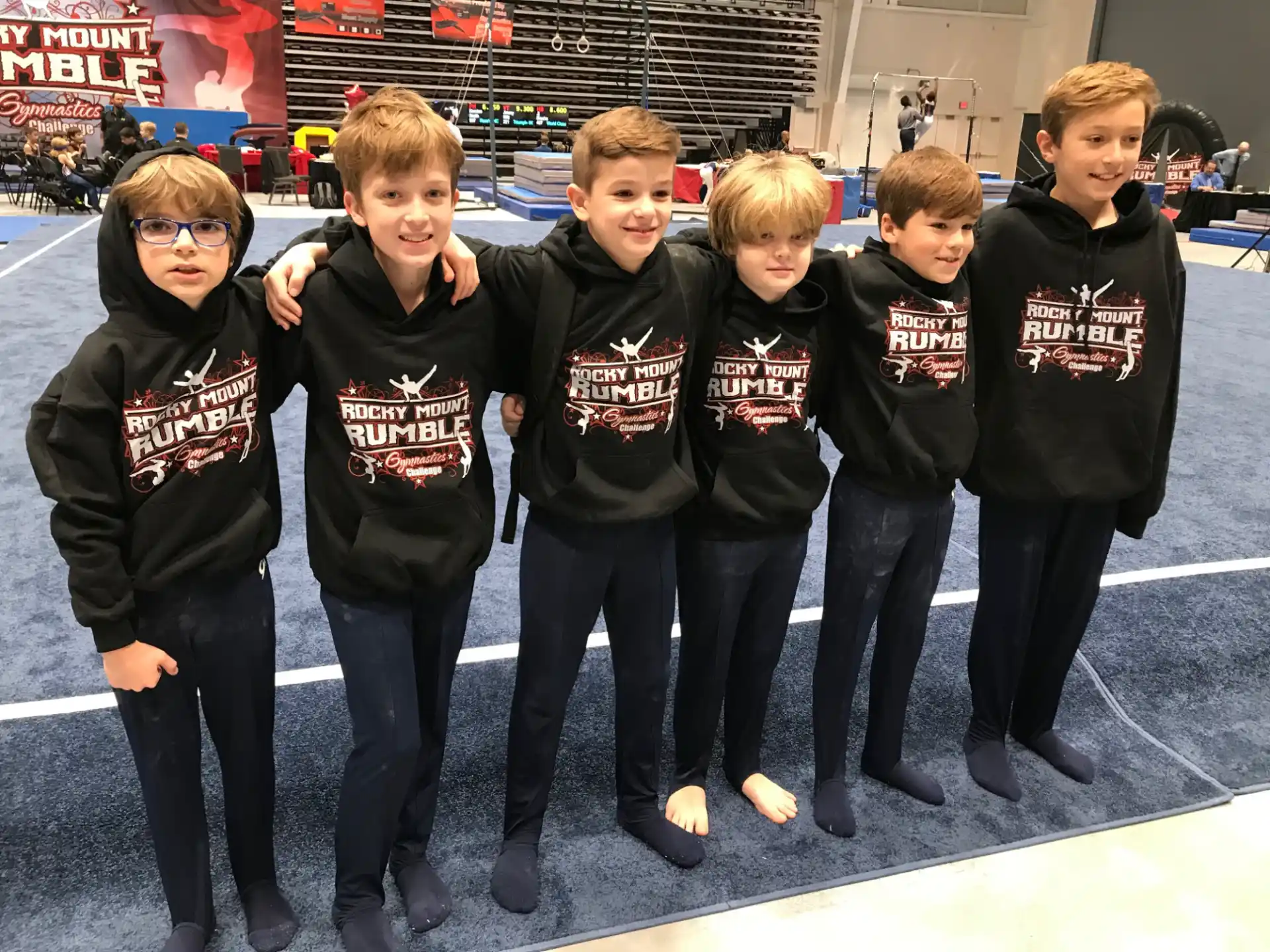 a group of boys in black shirts