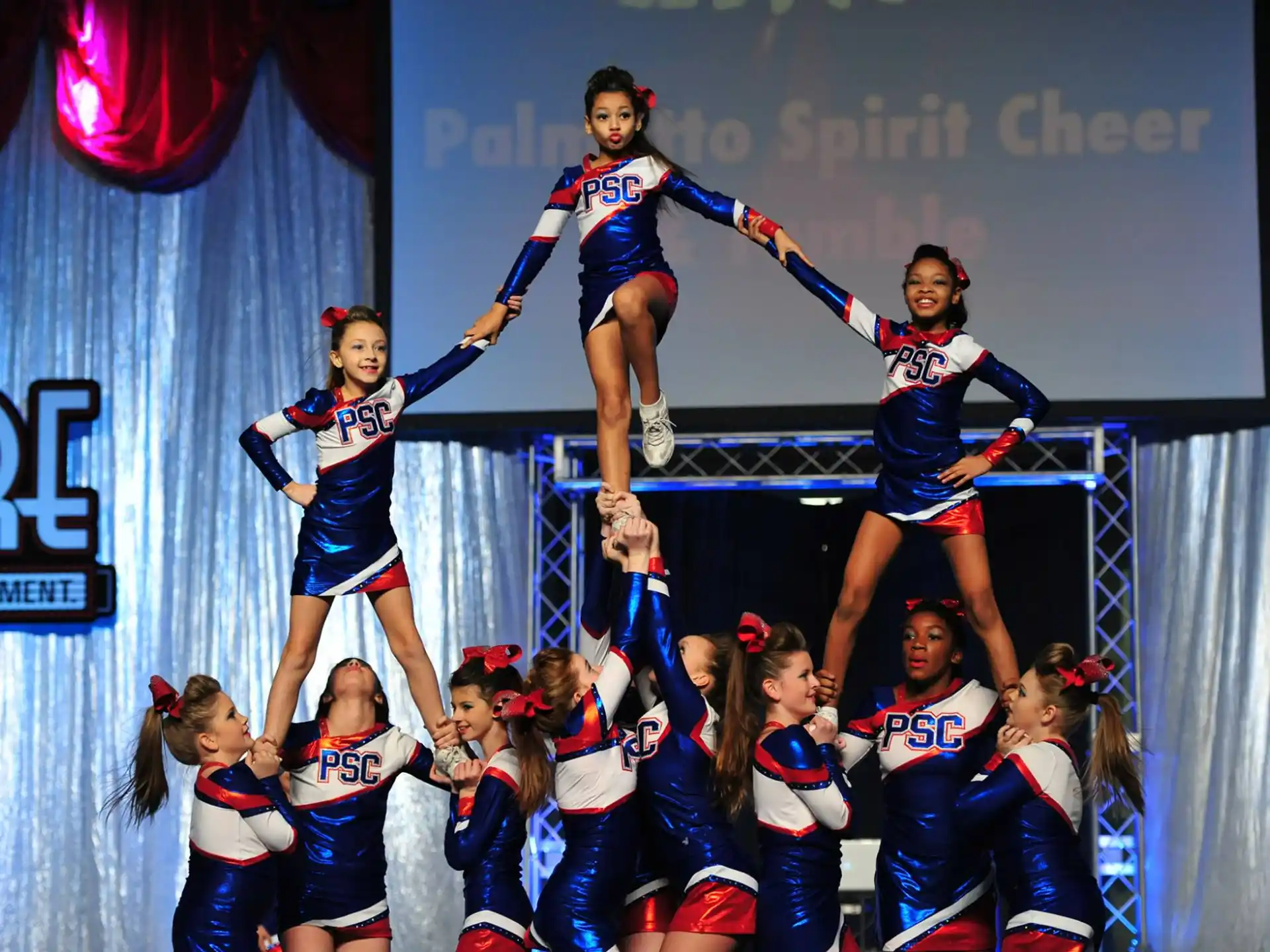 a group of cheerleaders on a stage