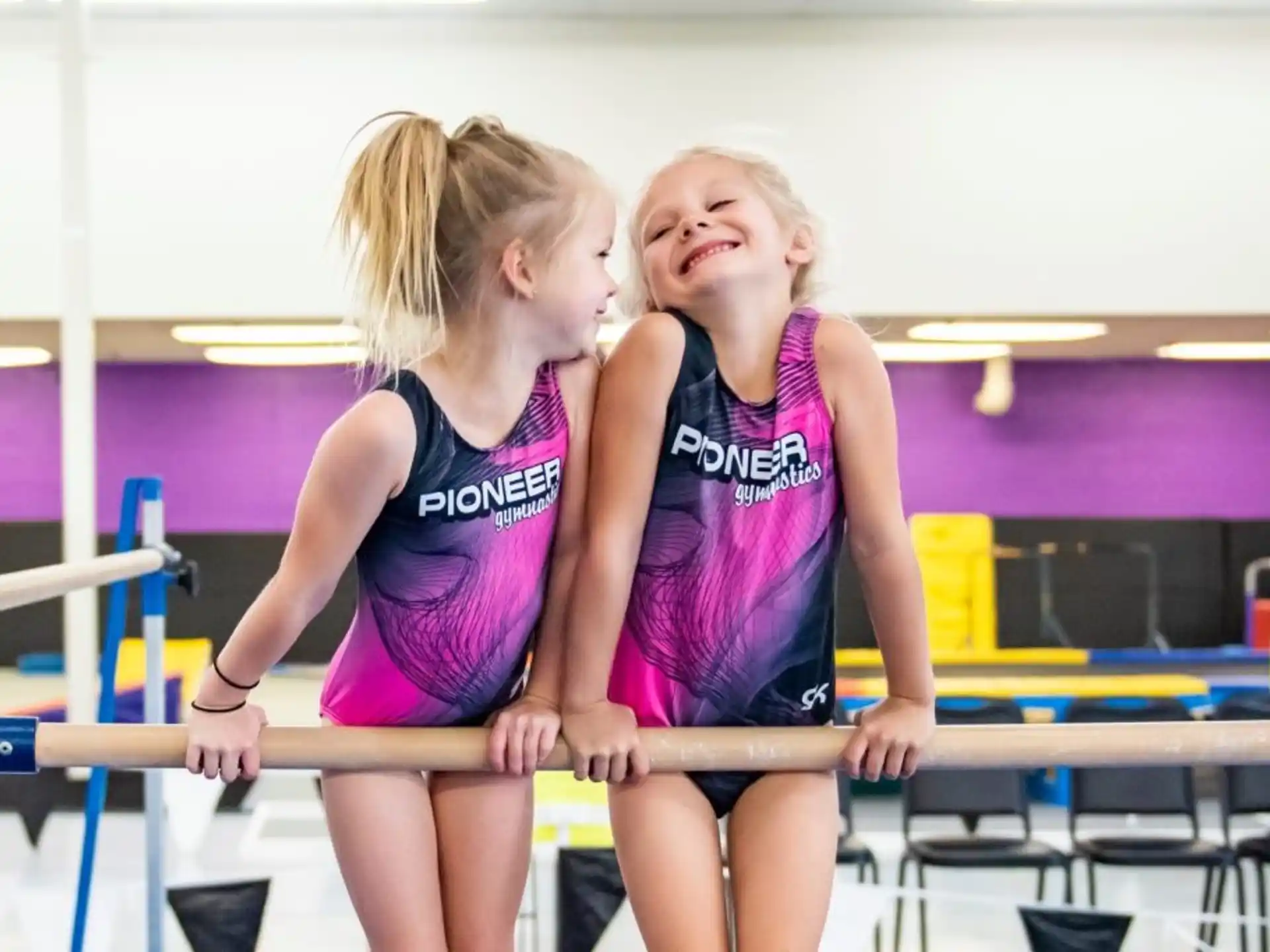 two girls in a gym