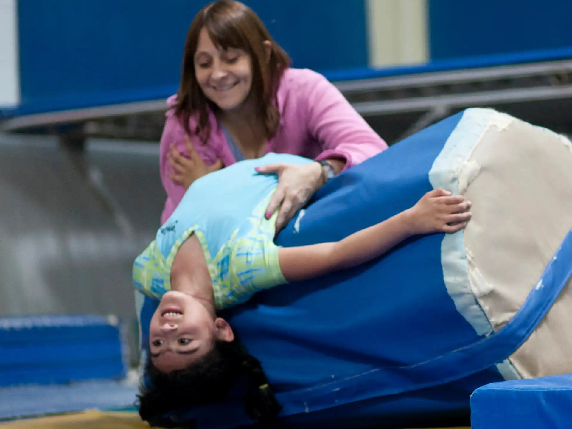 a woman sitting on a man's head